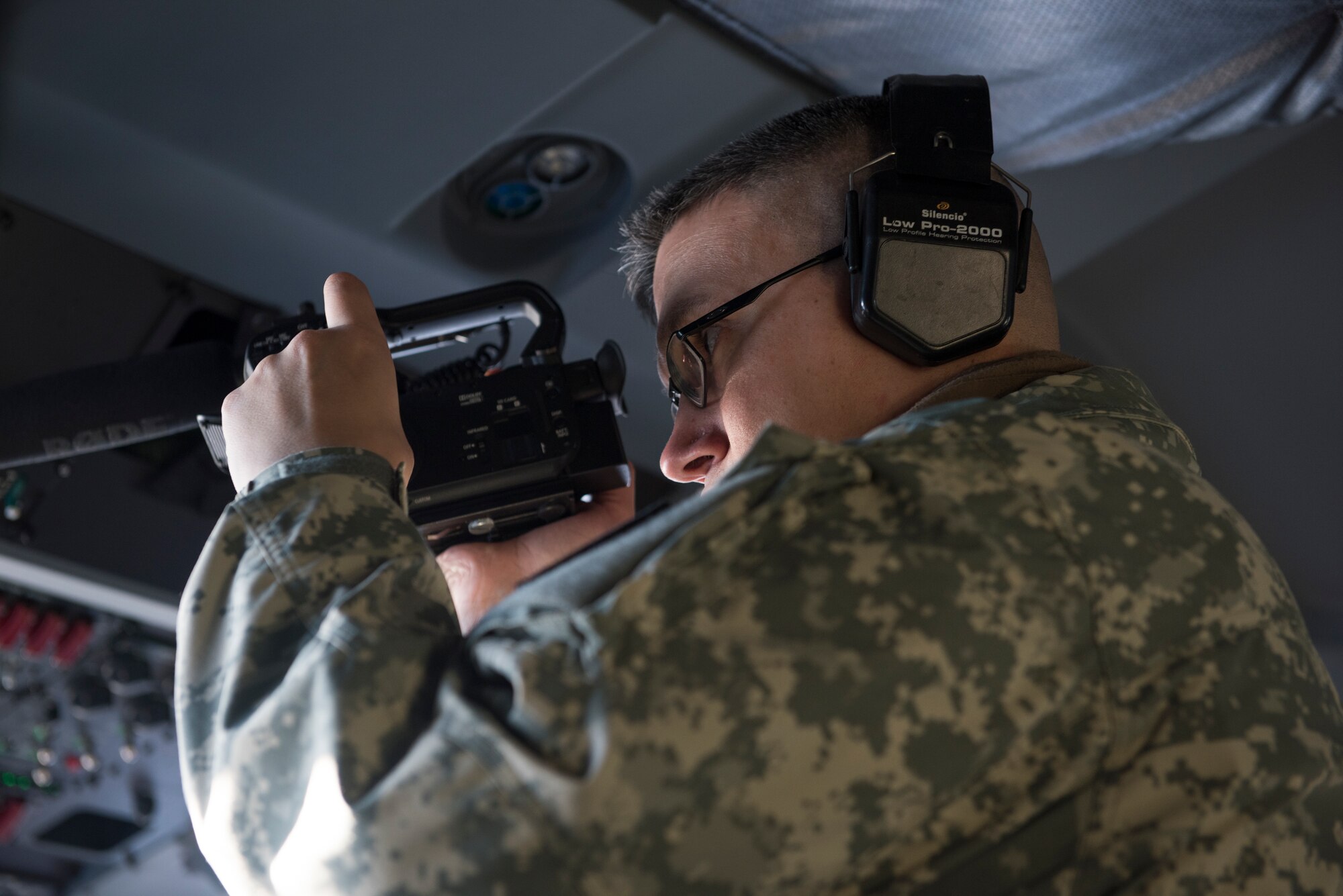 Army Sgt. David Bedard with the 134th Public Affairs Detachment, Alaska National Guard, records an aerial damage assessment Nov. 30, 2018, on a C-130J "Combat King II". In a matter of hours, members of the Alaska Air National Guard's Maintenance and Operation groups turned a planned community engagement into an aerial survey of earthquake damage in Southcentral Alaska, reporting findings to the State of Alaska's Joint Operations Center.