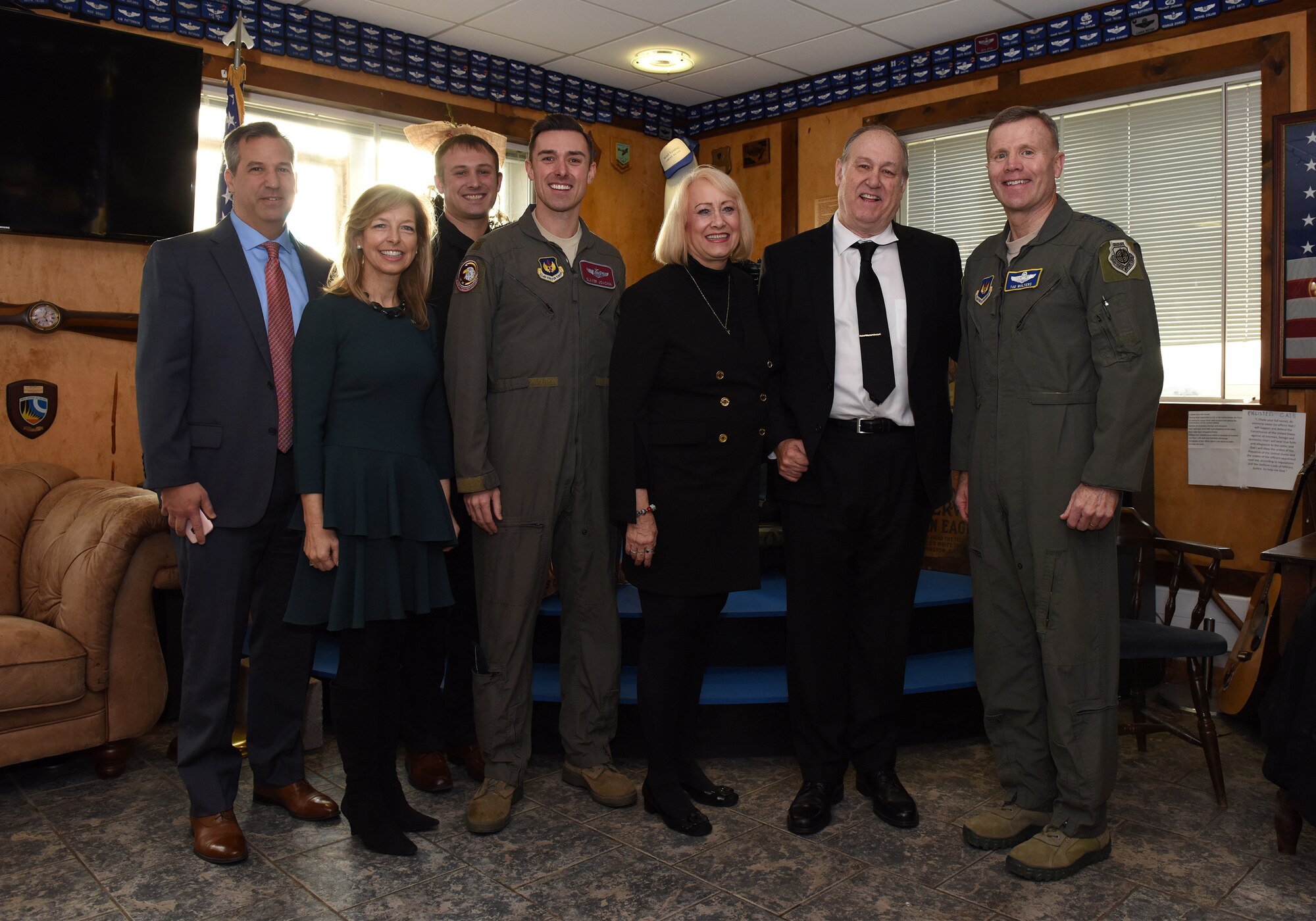 Colleen Shine, U.S. Air Force Gen. Tod D. Wolters, United States Air Forces in Europe – Air Forces Africa commander, Maj. Eric Joachim, 48th Operations Support Squadron chief of weapons, and family attend a reception after the presentation of the Lt. Col. Anthony C. Shine Fighter Pilot Award at Royal Air Force Lakenheath, Dec. 11, 2018. Joachim earned the prestigious award through his exceptional flying abilities, superior leadership and dedicated community involvement. (U.S. Air Force photo by Staff Sgt. Alex Echols)