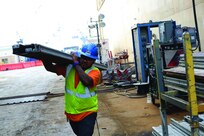 Man carrying items for ship maintenance  activities