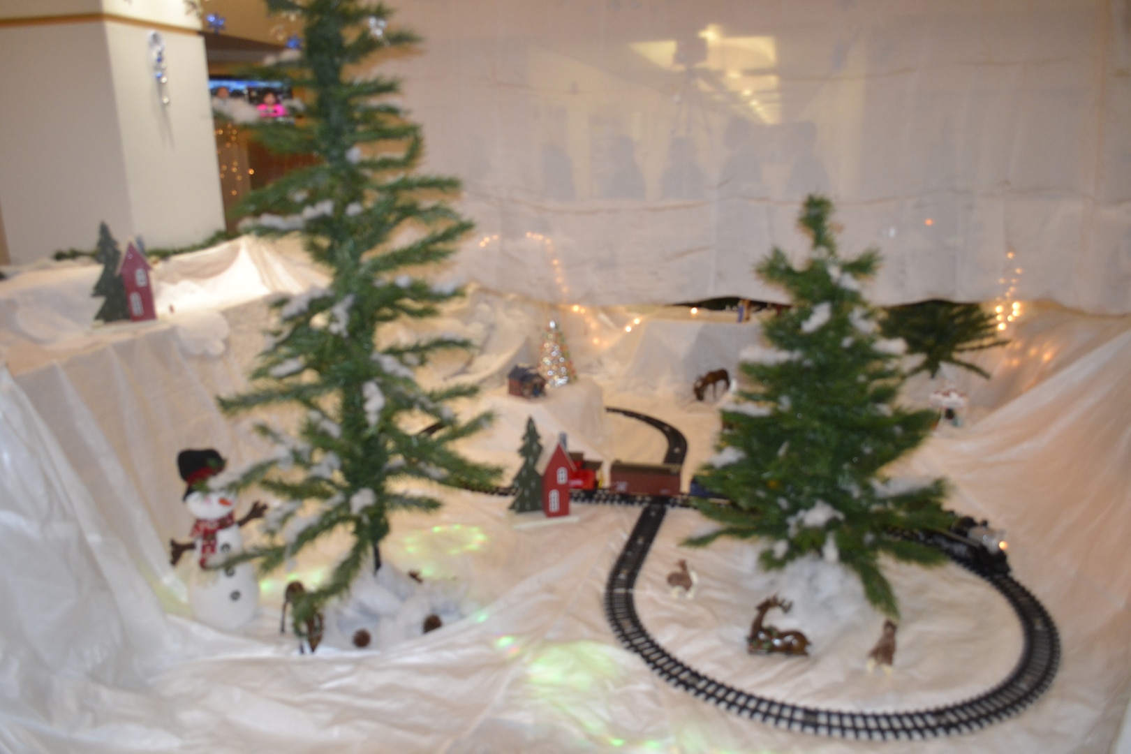 A train circles a winter landscape decorated with items representing the mission of the Construction and Equipment supply chain as part of their entry in the Defense Logistics Agency Troop Support’s 2018 holiday decorating contest in Philadelphia Dec. 20, 2018.