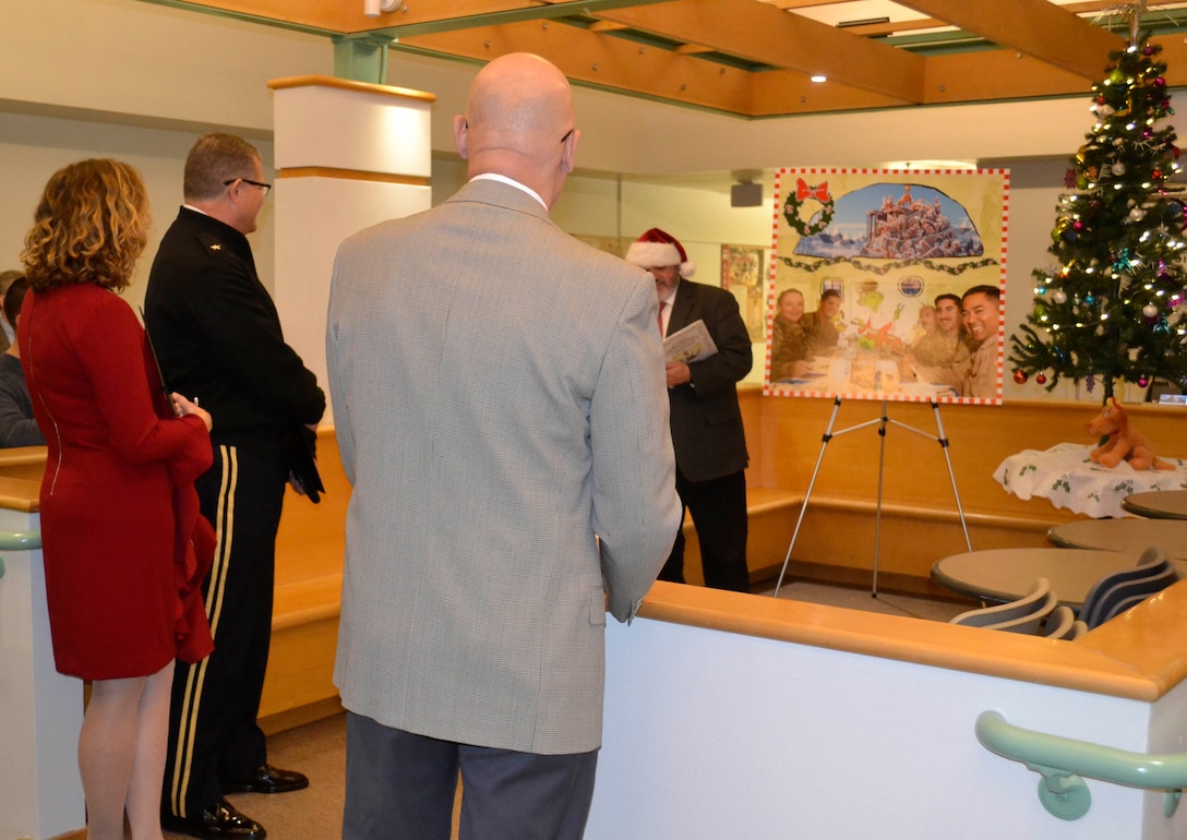 Defense Logistics Agency Troop Support leaders take in a presentation from the Subsistence supply chain as part of their entry in the 2018 holiday decorating contest in Philadelphia Dec. 20, 2018.