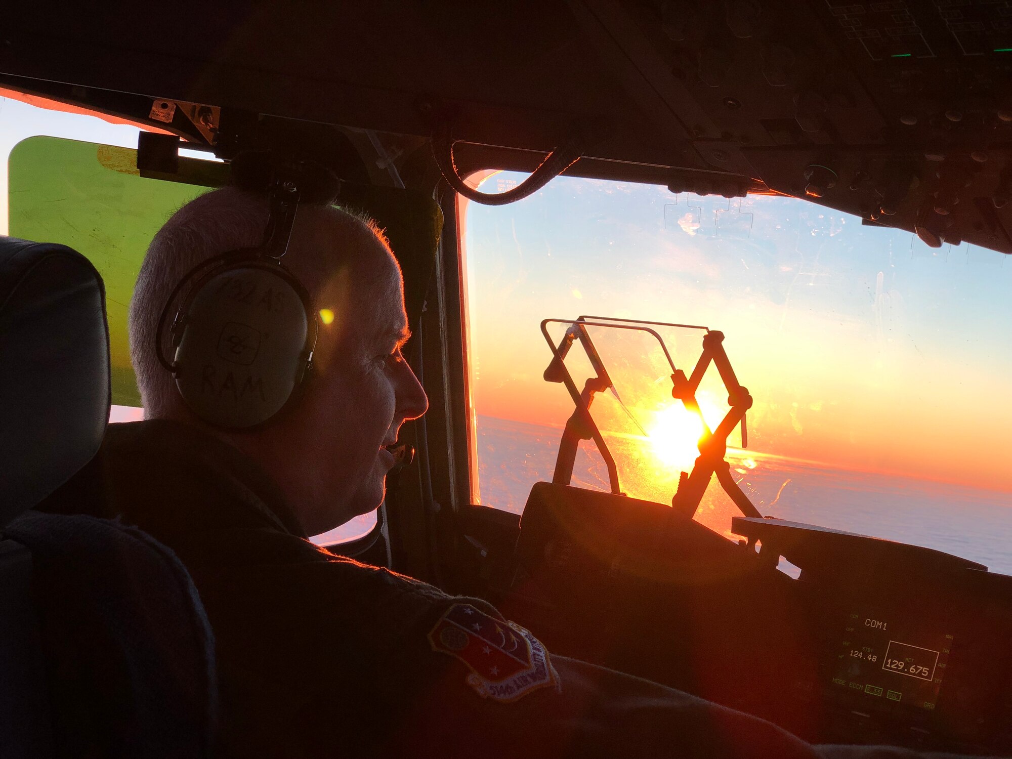 U.S. Air Force Col. Thomas O. Pemberton, 514th Air Mobility Wing commander, pilots a C-17 Globemaster III into the sunrise over Europe, en route to Ramstein Air Base, Germany, December 15, 2018.