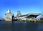 USS Kearsarge (LHD 3) and USS Arlington (LPD 24) in port gearing up for deployment