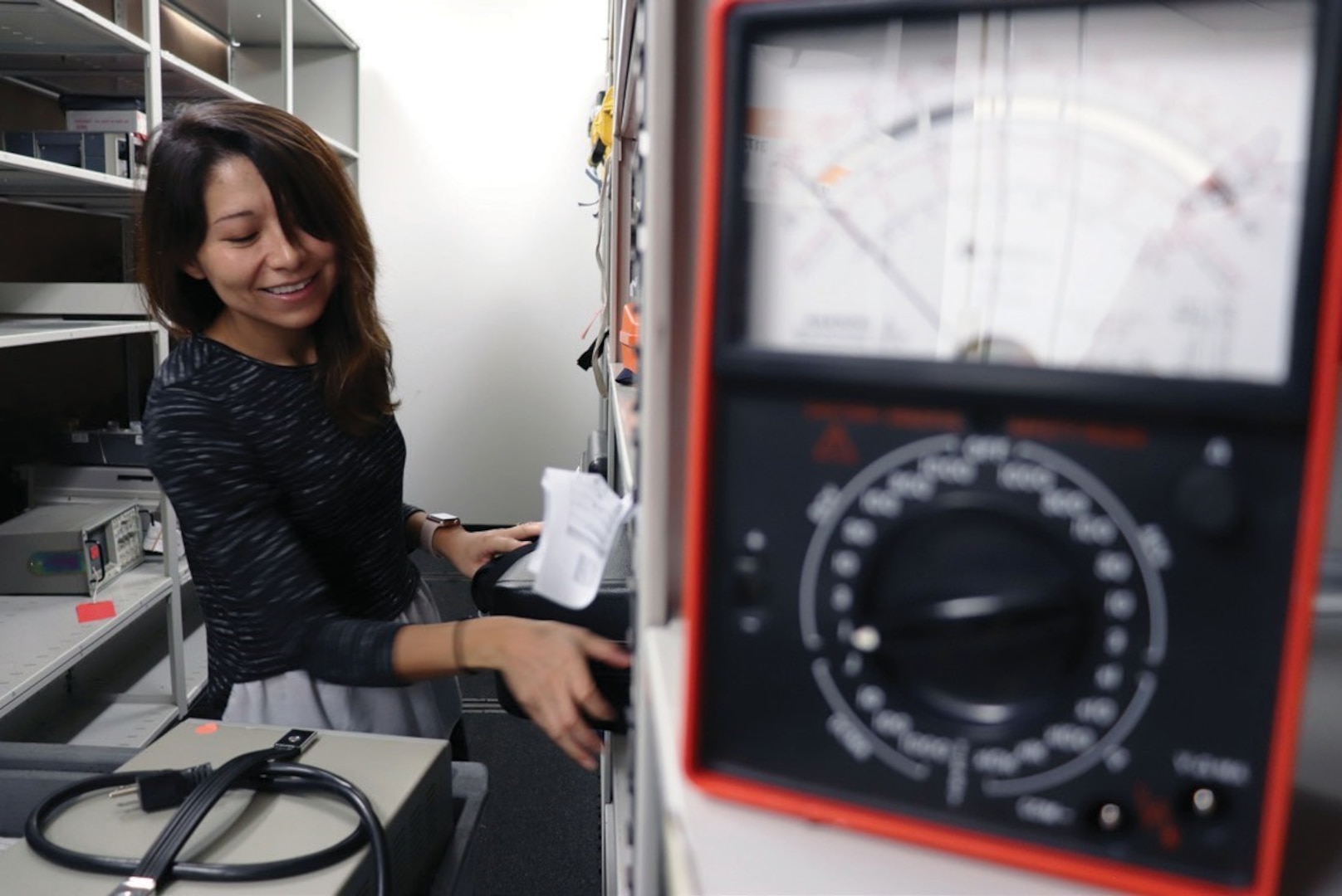 Employee testing electronic equipment