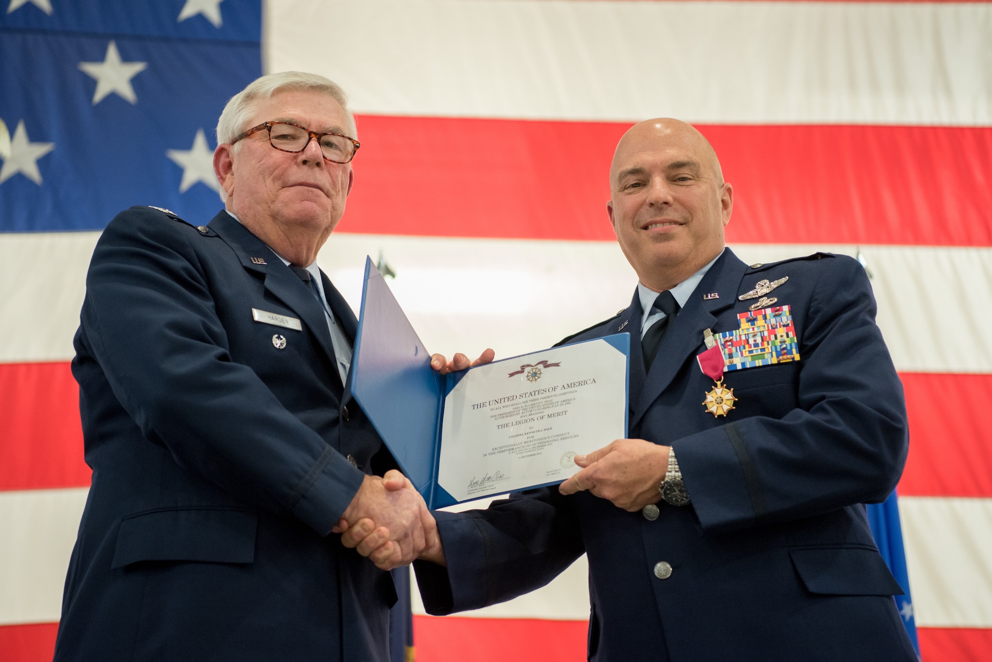 Col. Ken Dale (right), outgoing commander of the 123rd Maintenance Group, receives the Legion of Merit from retired Col. Michael Harden, former commander of the 123rd Airlift Wing, during Dale’s retirement ceremony at the Kentucky Air National Guard Base in Louisville, Ky., on Dec. 1, 2018. Dale is retiring after more than 38 years of service to the Kentucky Air National Guard. (U.S. Air National Guard photo by Staff Sgt. Joshua Horton)
