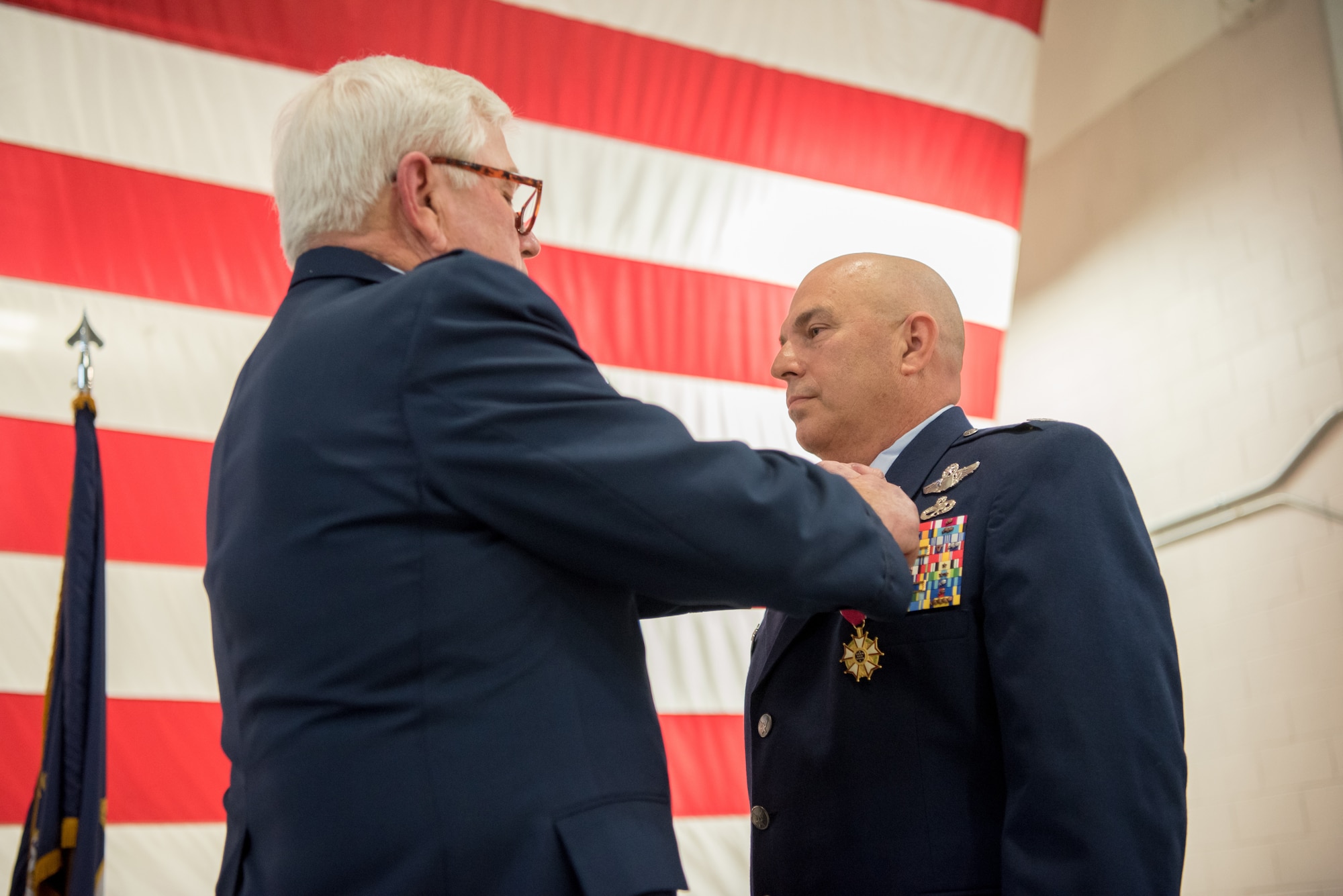 Col. Ken Dale (right), outgoing commander of the 123rd Maintenance Group, is pinned with the Distinguished Service Medal by retired Col. Michael Harden, former commander of the 123rd Airlift Wing, during Dale’s retirement ceremony at the Kentucky Air National Guard Base in Louisville, Ky., on Dec. 1, 2018. Dale is retiring after more than 38 years of service to the Kentucky Air National Guard. (U.S. Air National Guard photo by Staff Sgt. Joshua Horton)