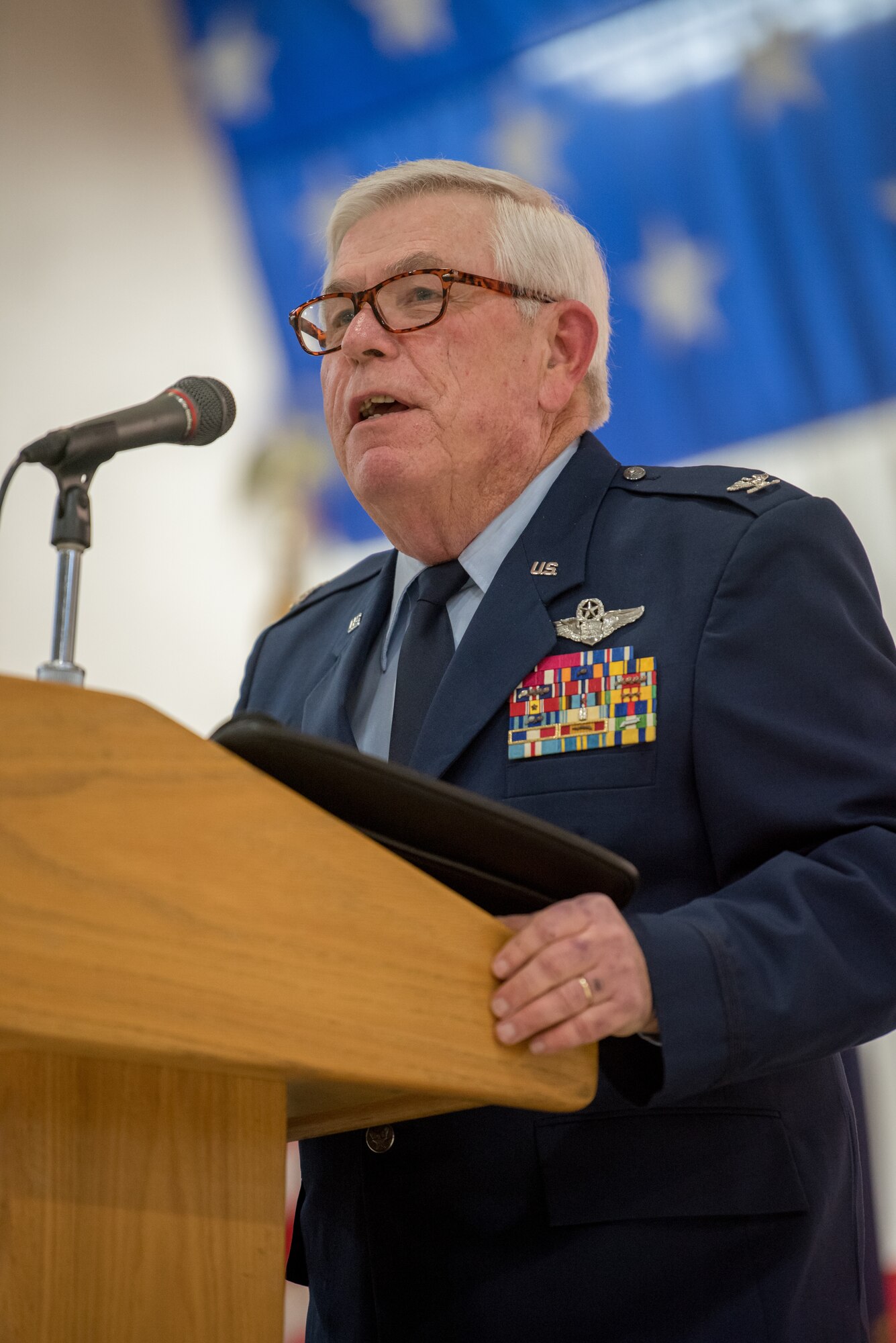 Retired Col. Michael Harden, former commander of the 123rd Airlift Wing, speaks at a retirement ceremony for Col. Ken Dale at the Kentucky Air National Guard Base in Louisville, Ky., on Dec. 1, 2018. Dale, outgoing commander of the 123rd Maintenance Group, served the Kentucky Air National Guard for 38 years. (U.S. Air National Guard photo by Staff Sgt. Joshua Horton)