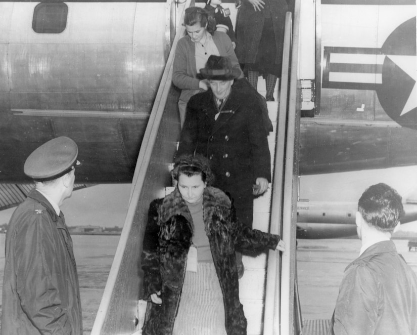 Col. Clinton C. Wasem, 1608th Air Transport Wing Commander, Charleston Air Force Base, S.C., greets Hungarian refugees on Dec. 10, 1956, as they arrive at Charleston AFB on a C-121 Constellation