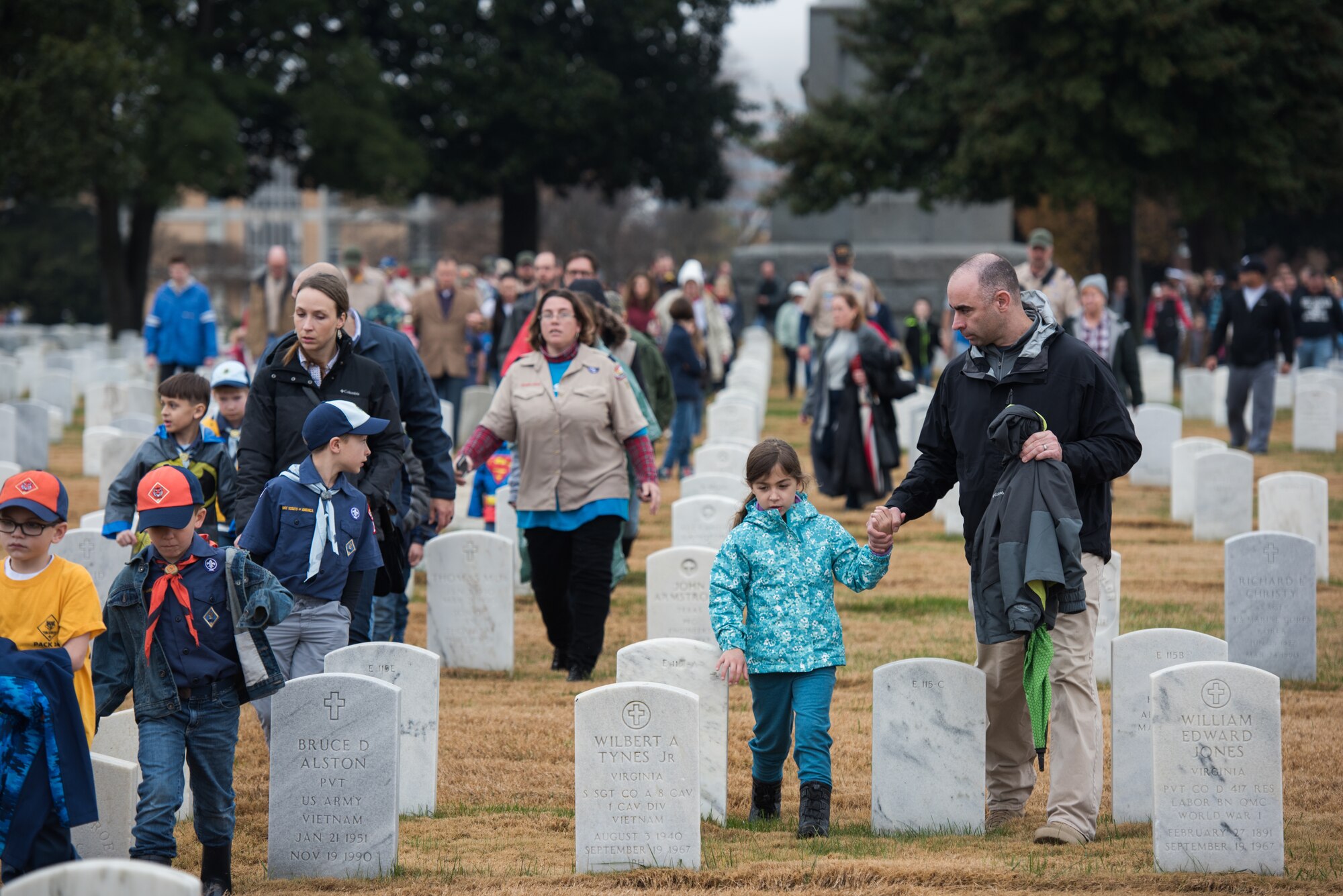 Joint Base Langley-Eustis and Hampton community members walk through Hampton National Cemetery in honor of National Wreaths Across America Day in Hampton, Virginia, Dec. 15, 2018.