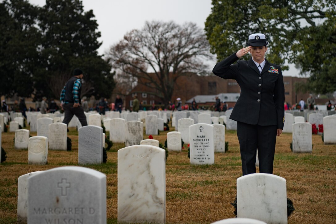 A U.S. Navy Sailor salutes the grave of a fallen member of the Armed Forces in honor of National Wreaths Across America Day at the Hampton National Cemetery in Hampton, Virginia, Dec. 15, 2018.