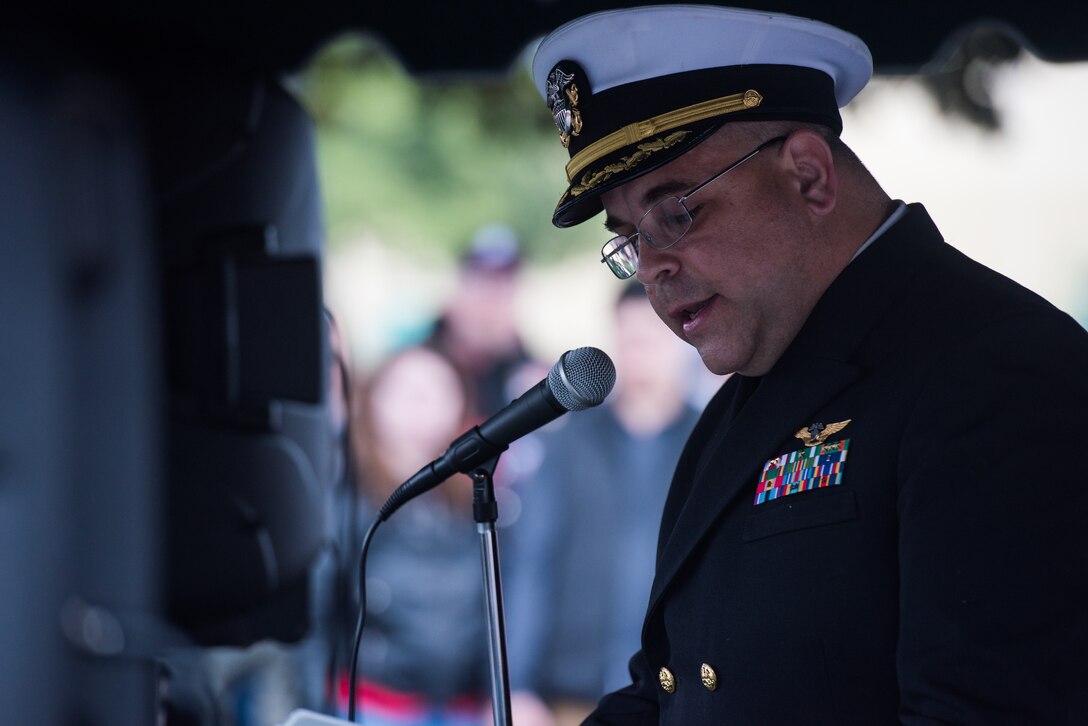 U.S. Navy Capt. Jeffery Chown, Commander Naval Air Forces Atlantic material readiness and supportive readiness director, speaks in honor of National Wreaths Across America Day at the Hampton National Cemetery in Hampton, Virginia, Dec. 15, 2018.