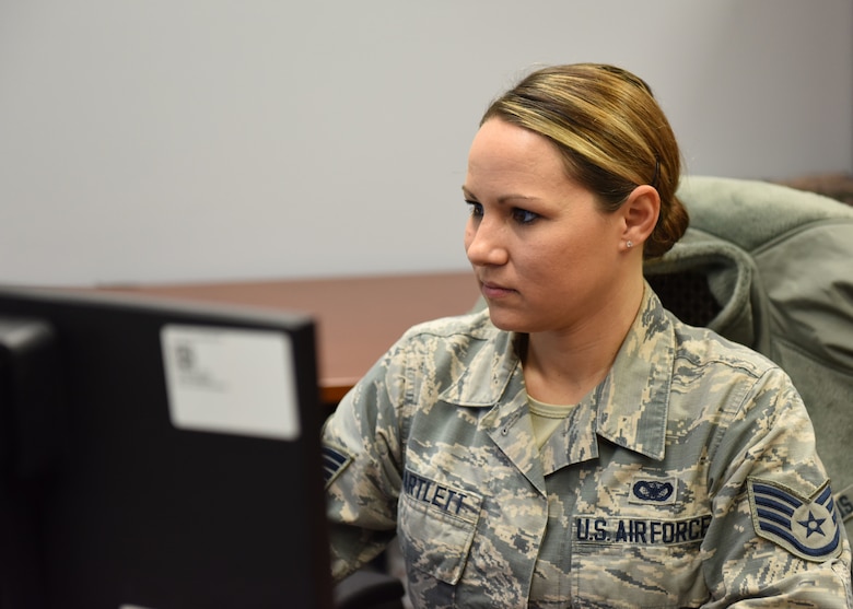 Staff Sgt. Gena Bartlett, command chief’s assistant with the 911th Airlift Wing, works on her computer at the Pittsburgh International Airport Air Reserve Station, Pennsylvania, Dec. 2, 2018. Bartlett is a member of the 911th Security Forces Squadron currently serving as the command chief assistant. She said that she loves the people and the work both in the wing and at 911th SFS. (U.S. Air Force Photo by Senior Airman Grace Thomson)