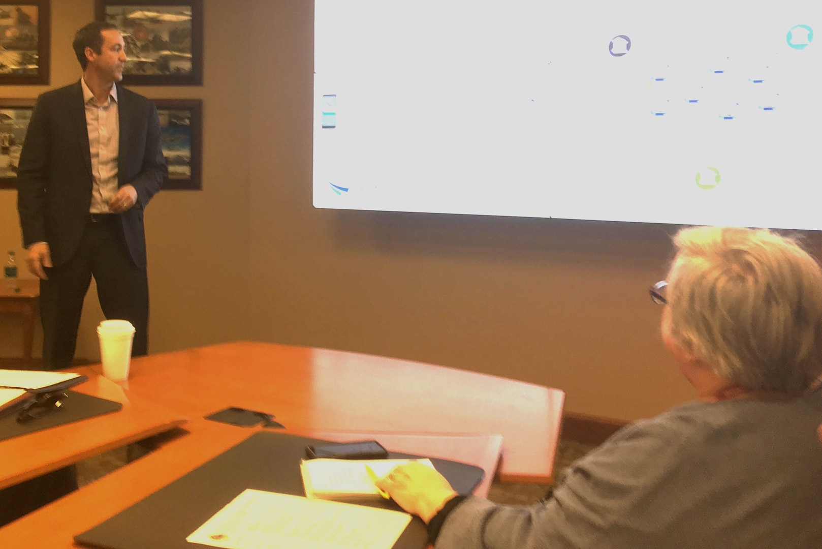 Craig Fischer (left), program manager with the Department of the Treasury’s Financial Innovation and Transformation Office, shares lessons learned from a blockchain pilot with DLA Troop Support leaders including Product Test Center-Analytical supervisor Jamie Hieber (right) at a meeting Dec. 3 in Philadelphia.