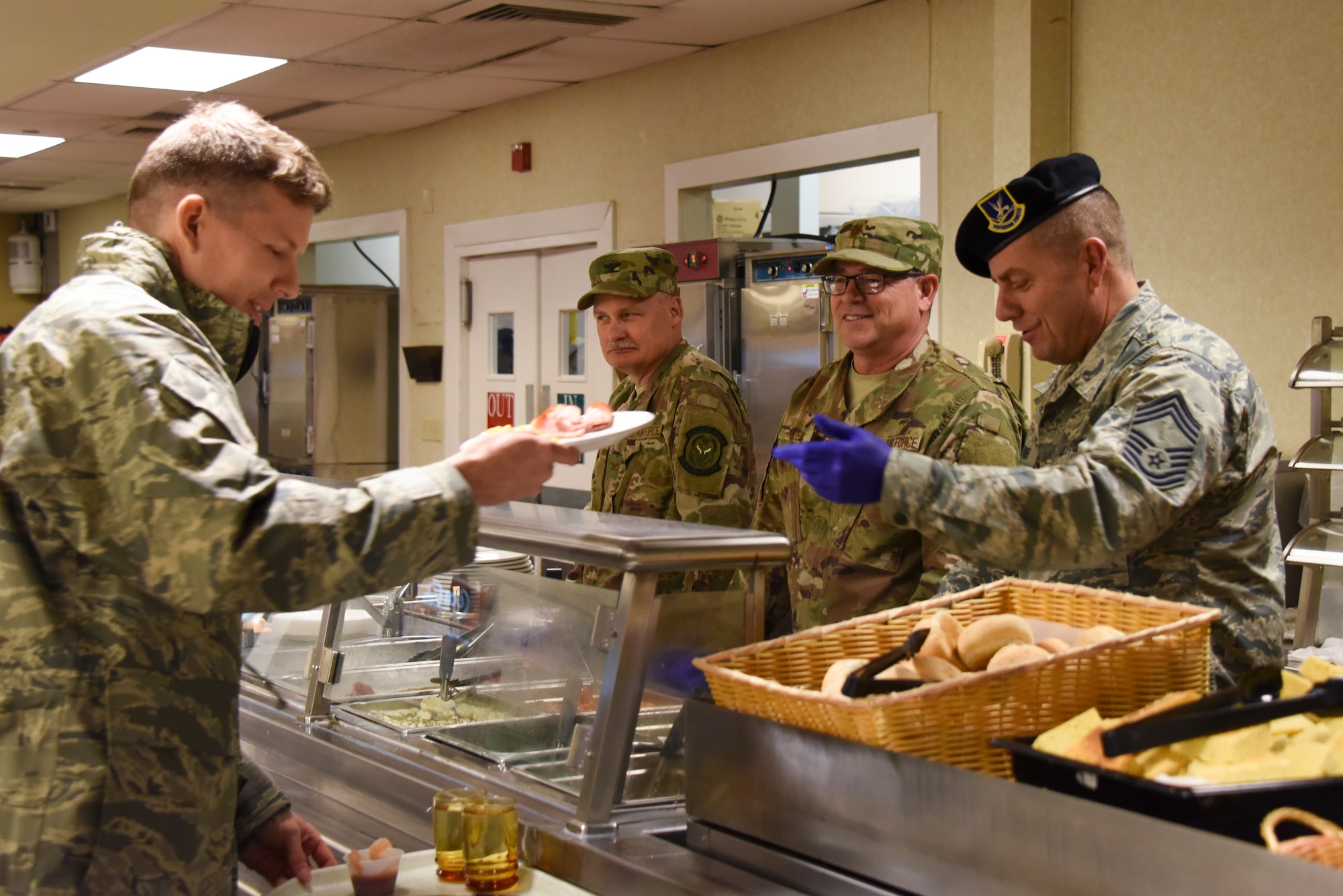 Base leadership serves a holiday meal to Airmen at the Pittsburgh International Airport Air Reserve Station, Pennsylvania, Dec. 1, 2018. Serving the annual holiday meal at unit training assemblies gives leadership the opportunity to interact with base members. (U.S. Air Force Photo by Senior Airman Brandon Shuman)