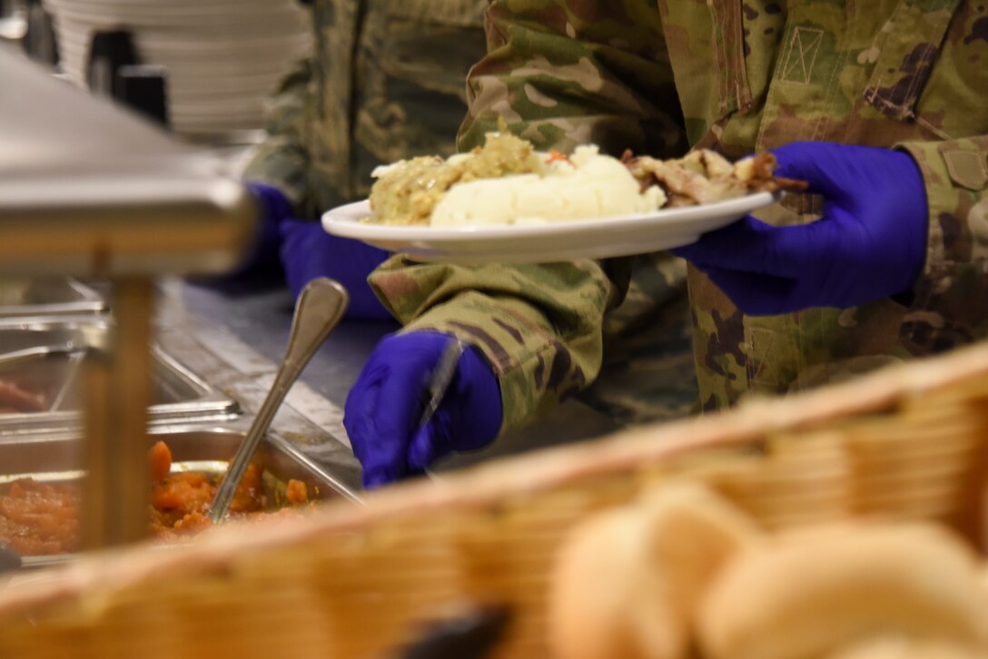 Base leadership serves a holiday meal at the Pittsburgh International Airport Air Reserve Station, Pennsylvania, Dec. 1, 2018. Serving the annual holiday meal at unit training assemblies gives leadership the opportunity to interact with base members. (U.S. Air Force Photo by Senior Airman Brandon Shuman)