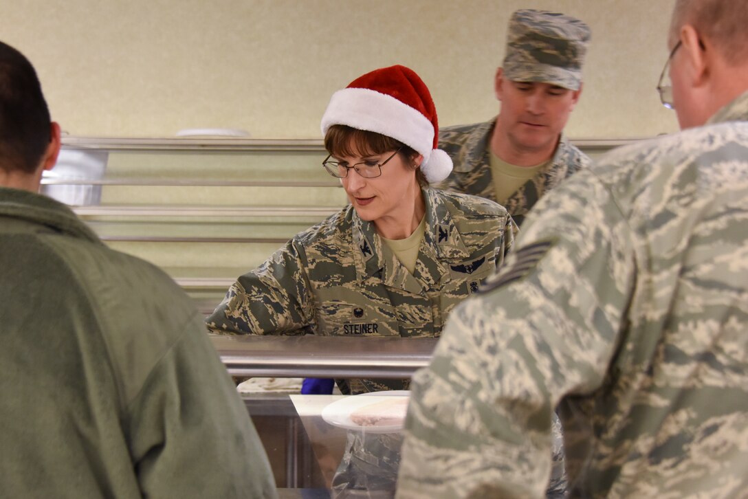 Col. Karen Steiner, commander of the 911th Aeromedical Staging Squadron, serves a holiday meal to Airmen at the Pittsburgh International Airport Air Reserve Station, Pennsylvania, Dec. 1, 2018. This is Steiner’s first holiday meal since returning to the 911th Airlift Wing, where she first transferred to the Air Force Reserves in 2007. (U.S. Air Force Photo by Senior Airman Brandon Shuman)