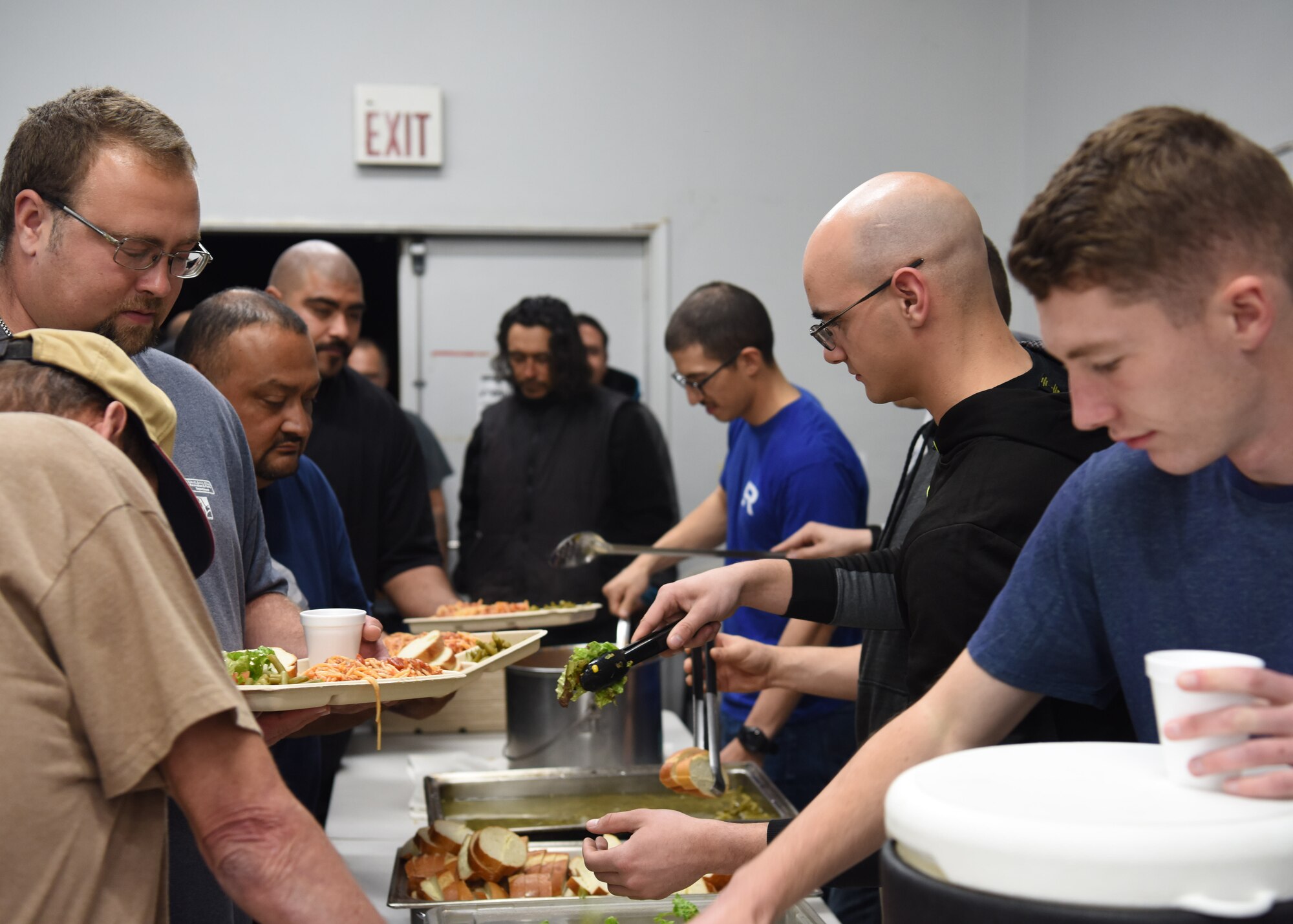 381st Training Group technical school Airmen serve the 83 residents of The Good Samaritan Bridgehouse Shelter in Lompoc, Calif. Dec. 20, 2018. “Food Service Teams are our greatest need,” stated on the Bridgehouse website. “We are always looking for volunteers who are willing to prepare meals as a group in the kitchen of one of our shelter facilities.” (U.S. Air Force photo by Airman 1st Class Aubree Milks/Released)