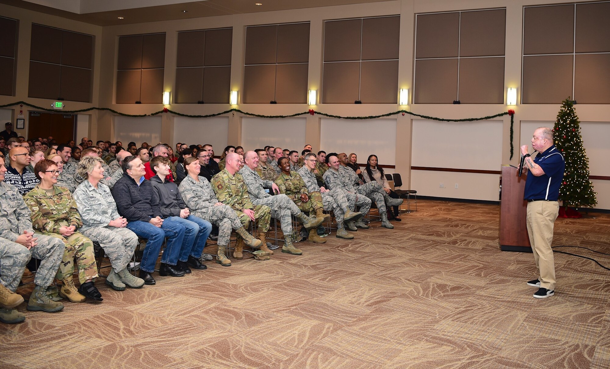 Senior Master Sgt. Israel Del Toro, 98th Flying Training Squadron accelerated freefall training program superintendent, shares his story of overcoming adversity with members of Team Buckley, Dec. 20, 2018, at Buckley Air Force Base, Colo. Del Toro was injured in Afghanistan, Dec. 4, 2005, and became the first 100 percent disabled Airman to reenlist in the Air Force on Feb. 8, 2010. (U.S. Air Force photo by Airman 1st Class Michael D. Mathews)