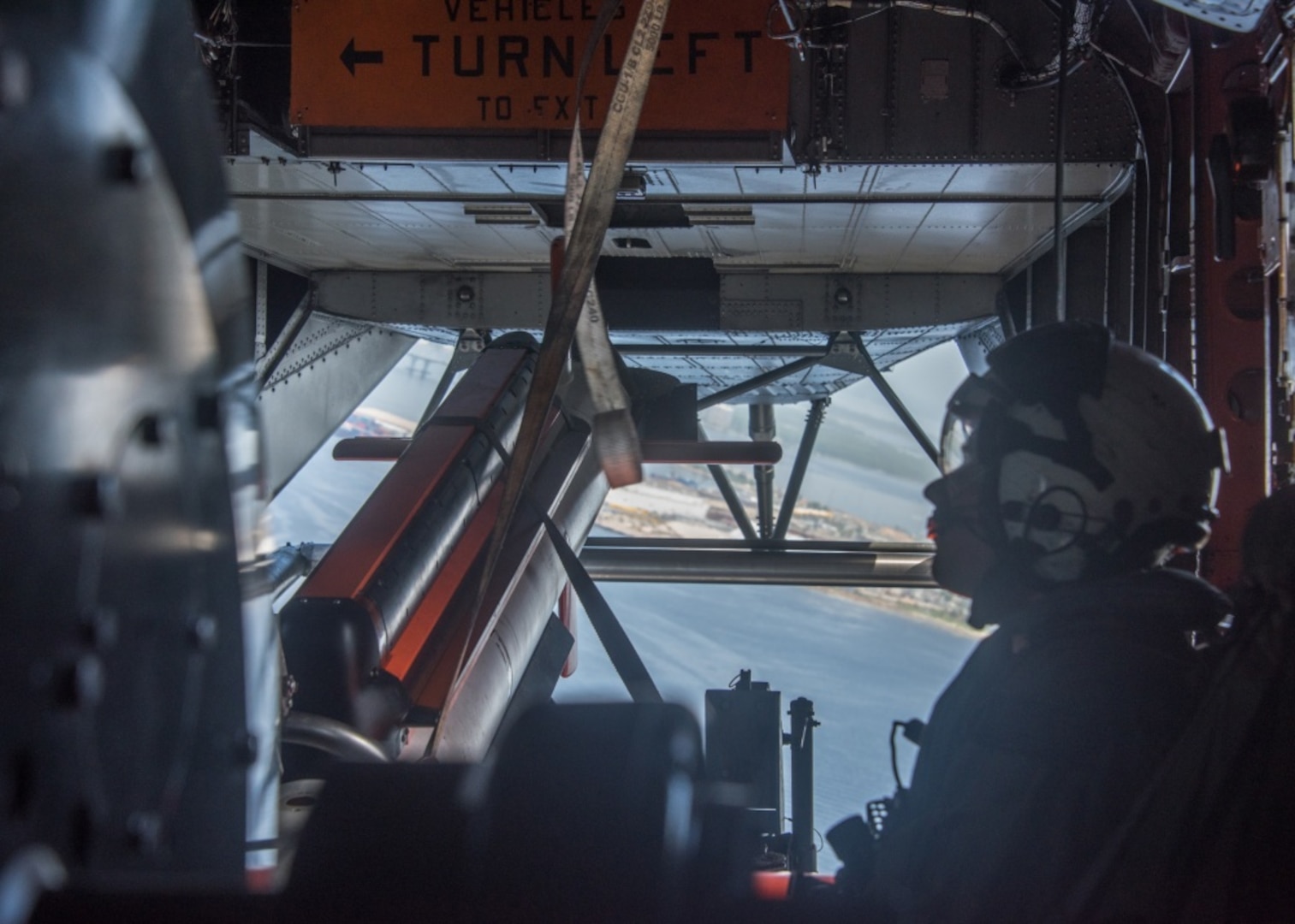 Flight Test crew member of Helicopter Mine Countermeasures Squadron 15 shown in flight ready to begin Government Acceptance Testing of the AN/AQS-24C Mine Detecting Set June 19, 2018. U.S. Navy photo by Anthony Powers.