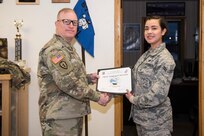 U.S. Air Force Airman 1st Class Karlie Gamez, 673d Logistics Readiness Squadron mobile distribution operator, receives the Arctic Warrior of the Week award on Joint Base Elmendorf-Richardson, Alaska, Dec. 21, 2018. The AWOW is an award highlighting JBER's top performing Airmen.