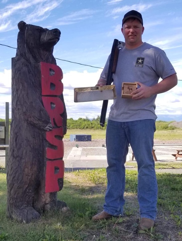 SFC Stoa stands with his trophies at the Alaska State Trapshooting Championship.