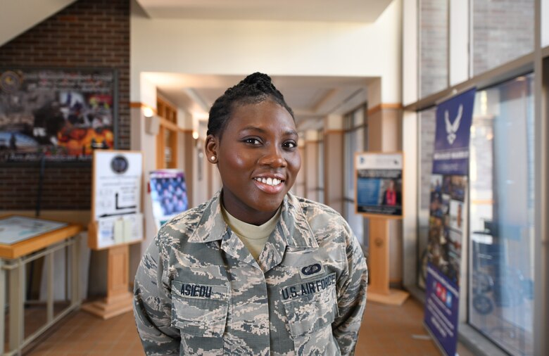 Senior Airman Bernice Asiedu, a 28th Comptroller Squadron customer service technician, stands in the Rushmore Building on Ellsworth Air Force Base, S.D., Dec. 20, 2018. Asiedu, originally from Ghana, came to the U.S. via the Electronic Diversity Lottery.  In the year she was selected, more than 14 million people applied. Asiedu had less than a 1 percent chance of being selected. (U.S. Air Force photo by Airman 1st Class Thomas Karol)