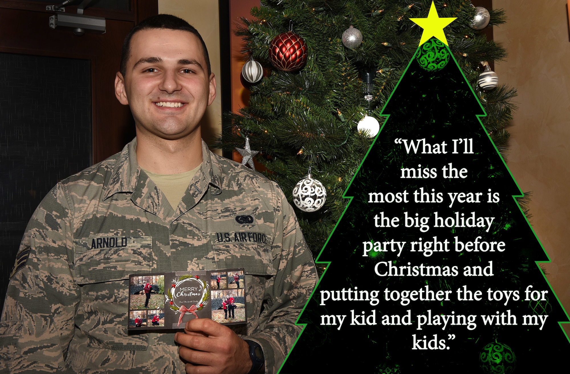 Airman holds family Christmas photos.