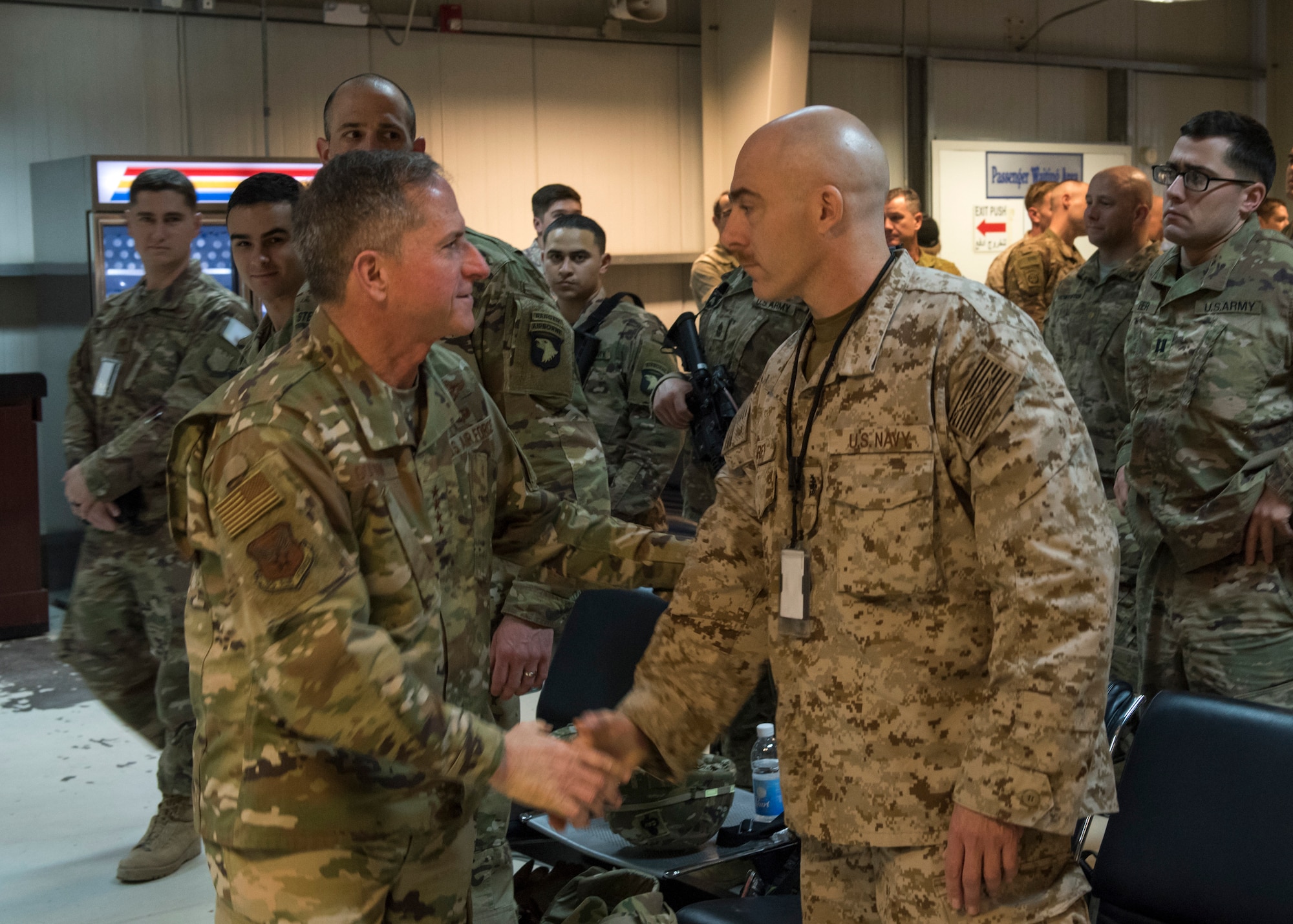 Air Force Chief of Staff Gen. David L. Goldfein shakes a sailor’s hand upon arrival to an undisclosed location in Southwest Asia, Dec. 20, 2018. Service members of different branches were given the opportunity to shake hands and welcome Goldfein during his visit. (U.S. Air Force photo by Staff Sgt. Jeremy L. Mosier.)