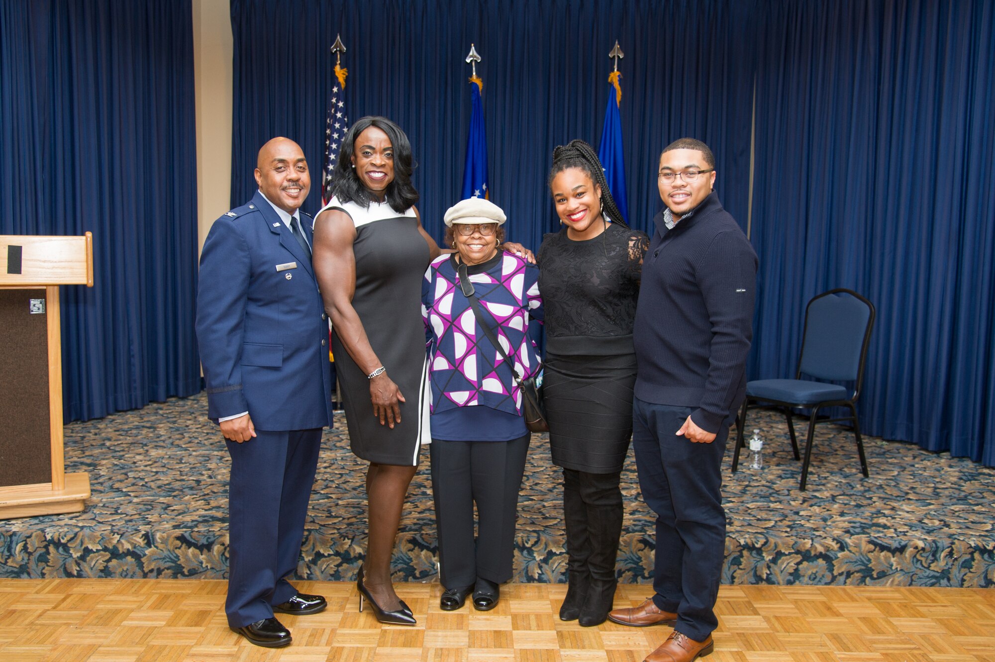 Colonel Lloyd Terry poses for a picture with his family (L to R his wife, Olivia, his mother, Juanita Terry, his daughter in law, Katoya Terry and his son Lloyd Terry III) after his retirement ceremony, Friday, December 14 at Naval Air Station Fort Worth Joint Reserve Base, Texas.