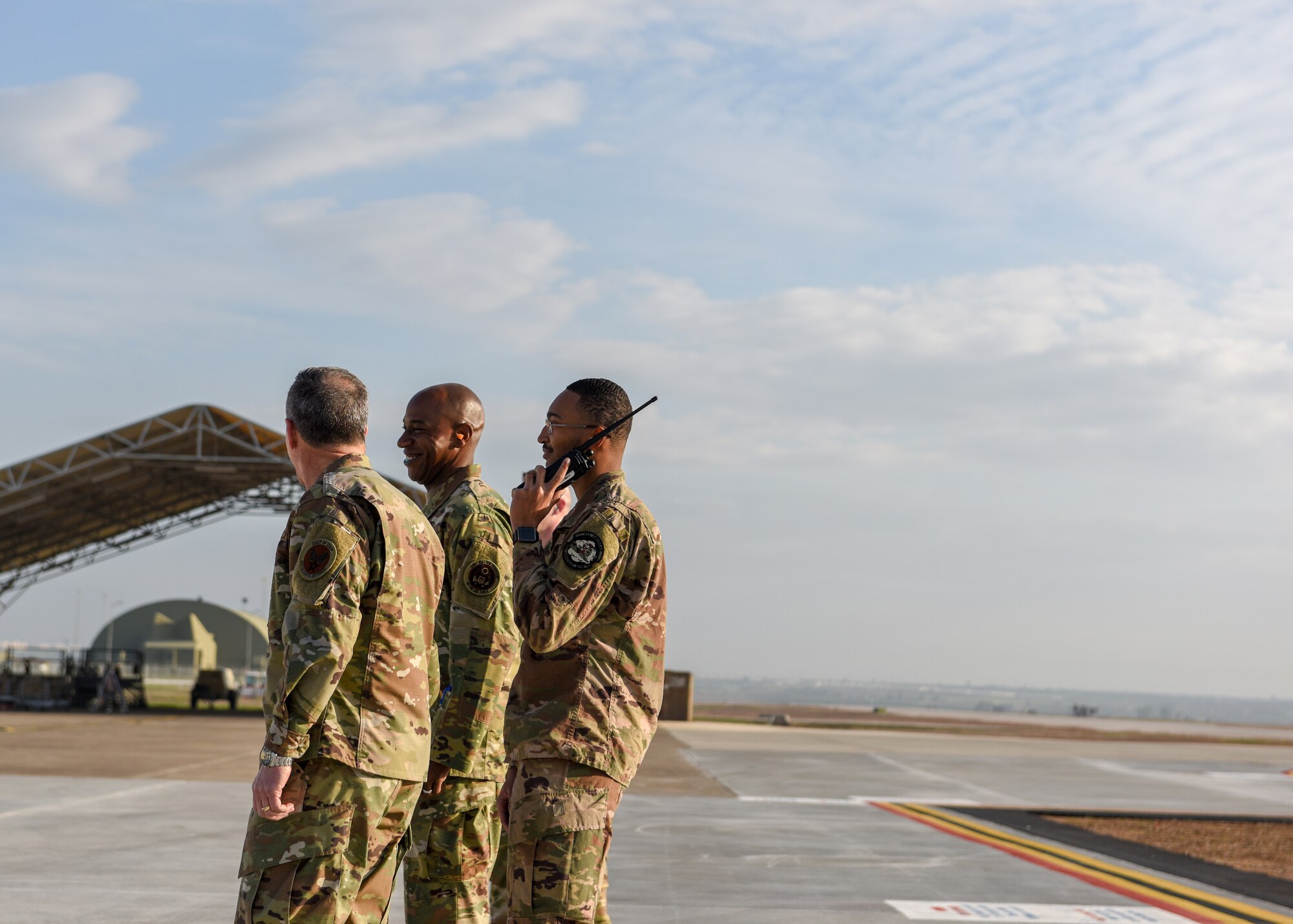 An Airman talks to Air Force Chief of Staff and Chief Master Sgt. of the Air Force.