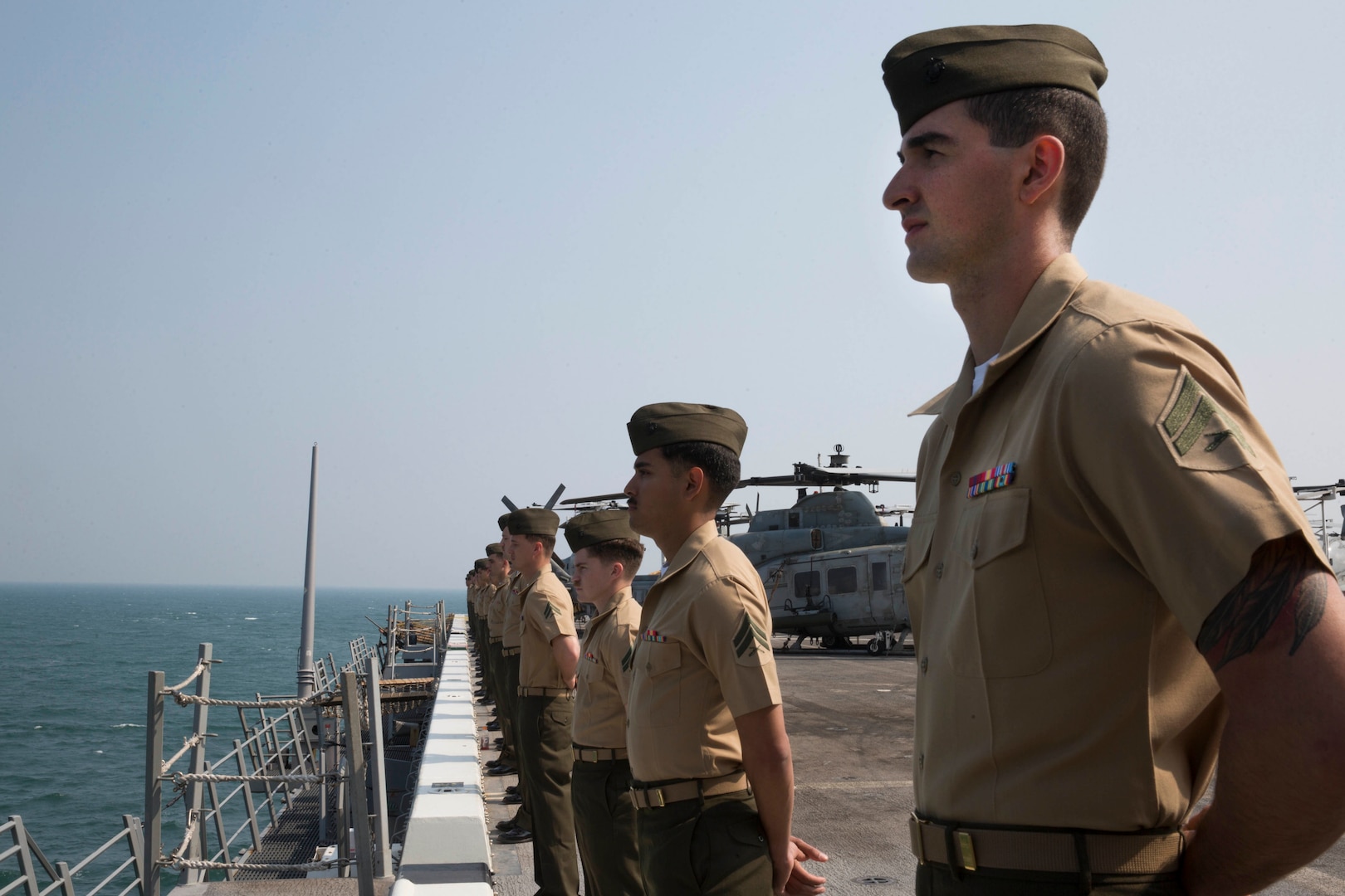 U.S. Marines with the 13th Marine Expeditionary Unit (MEU), man the rails of the San Antonio-class amphibious transport dock USS Anchorage (LPD 23), Dec. 22, 2018. The Anchorage, assigned to the Essex Amphibious Ready Group (ARG), is conducting a partnership strengthening visit to Visakhapatnam, India.  The Essex ARG and 13th MEU are a capable and lethal Navy-Marine Corps team deployed to the U.S. 7th Fleet area of operations to support regional stability, reassure partners and allies and maintain a presence postured to respond to any crisis ranging from humanitarian assistance to contingency operations.