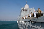 Sailors assigned to the San Antonio-class amphibious transport dock ship USS Anchorage (LPD 23) and Marines assigned to the 13th Marine Expeditionary Unit (MEU) man the rails during a port visit to Visakhapatnam while on a deployment of the Essex Amphibious Ready Group (ARG) and 13th MEU. The Essex ARG/ 13th MEU is a capable and lethal Navy-Marine Corps team deployed to the 7th Fleet area of operations to support regional stability, reassure partners and allies and maintain a presence postured to respond to any crisis ranging from humanitarian assistance to contingency operations.