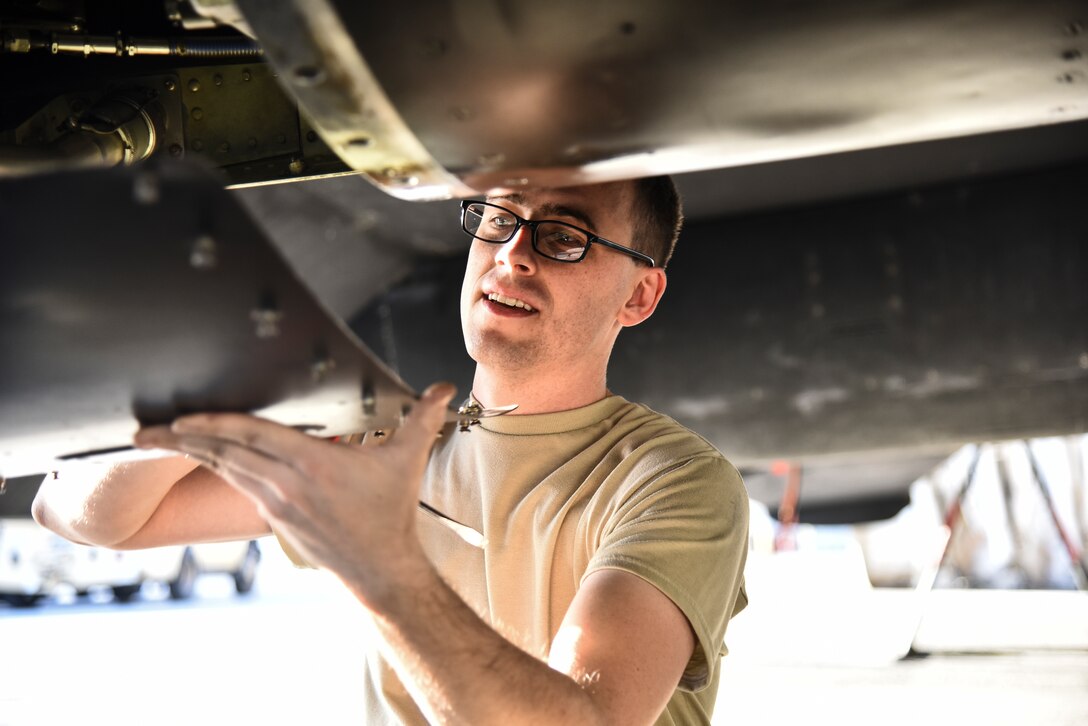 U.S. Air Force Airman 1st Class Dustin Giesick, 380th Expeditionary Aircraft Maintenance Squadron U-2 Dragon Lady crew chief, unscrews a panel off of a U-2 at Al Dhafra Air Base, United Arab Emirates, Dec. 18, 2018. The crew chief’s extensive list of responsibilities including for pre-, post- and thru-flight checks, and well as various inspections, allows them to fully understand their vital role, making them jacks-of-all-trades when it comes to repairing the aircraft. (U.S. Air Force photo by Senior Airman Mya M. Crosby)