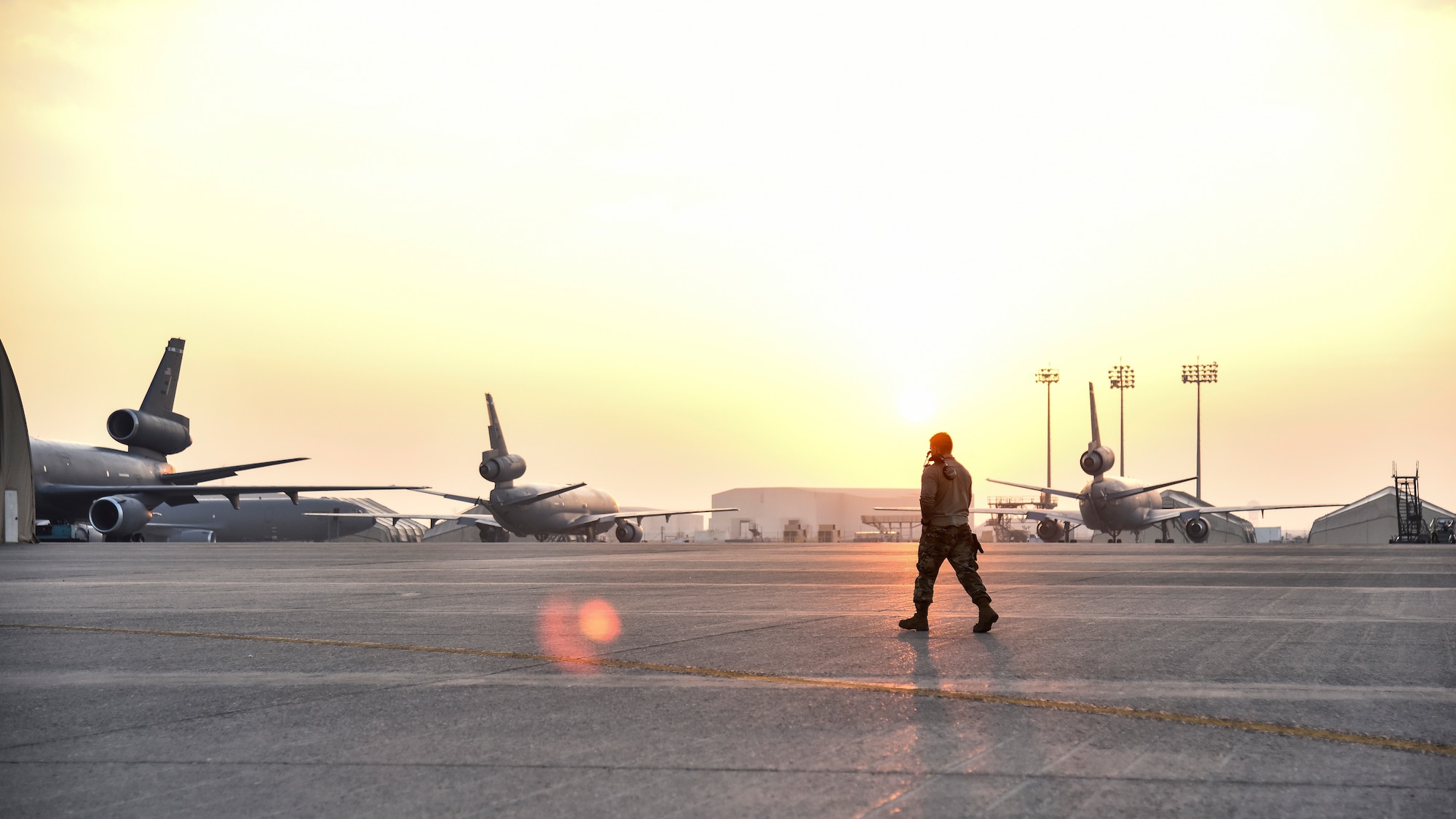 U.S. Air Force Senior Airman Devon Gilbert, 380th Expeditionary Aircraft Maintenance Squadron E-3 AWACS Sentry crew chief, walks down the flight line at Al Dhafra Air Base, United Arab Emirates, Dec. 20, 2018. The crew chief’s extensive list of responsibilities including for pre-, post- and thru-flight checks, and well as various inspections, allows them to fully understand their vital role, making them jacks-of-all-trades when it comes to repairing the aircraft. (U.S. Air Force photo by Senior Airman Mya M. Crosby)