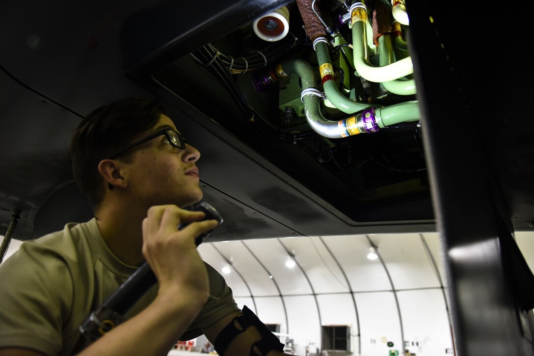 U.S. Air Force Airman 1st Class Nathan Horsley, 380th Expeditionary Aircraft Maintenance Squadron RQ-4 Global Hawk crew chief, conducts a pre-flight inspection on an RQ-4 at Al Dhafra Air Base, United Arab Emirates, Dec. 20, 2018. The crew chief’s extensive list of responsibilities including for pre-, post- and thru-flight checks, and well as various inspections, allows them to fully understand their vital role, making them jacks-of-all-trades when it comes to repairing the aircraft. (U.S. Air Force photo by Senior Airman Mya M. Crosby)