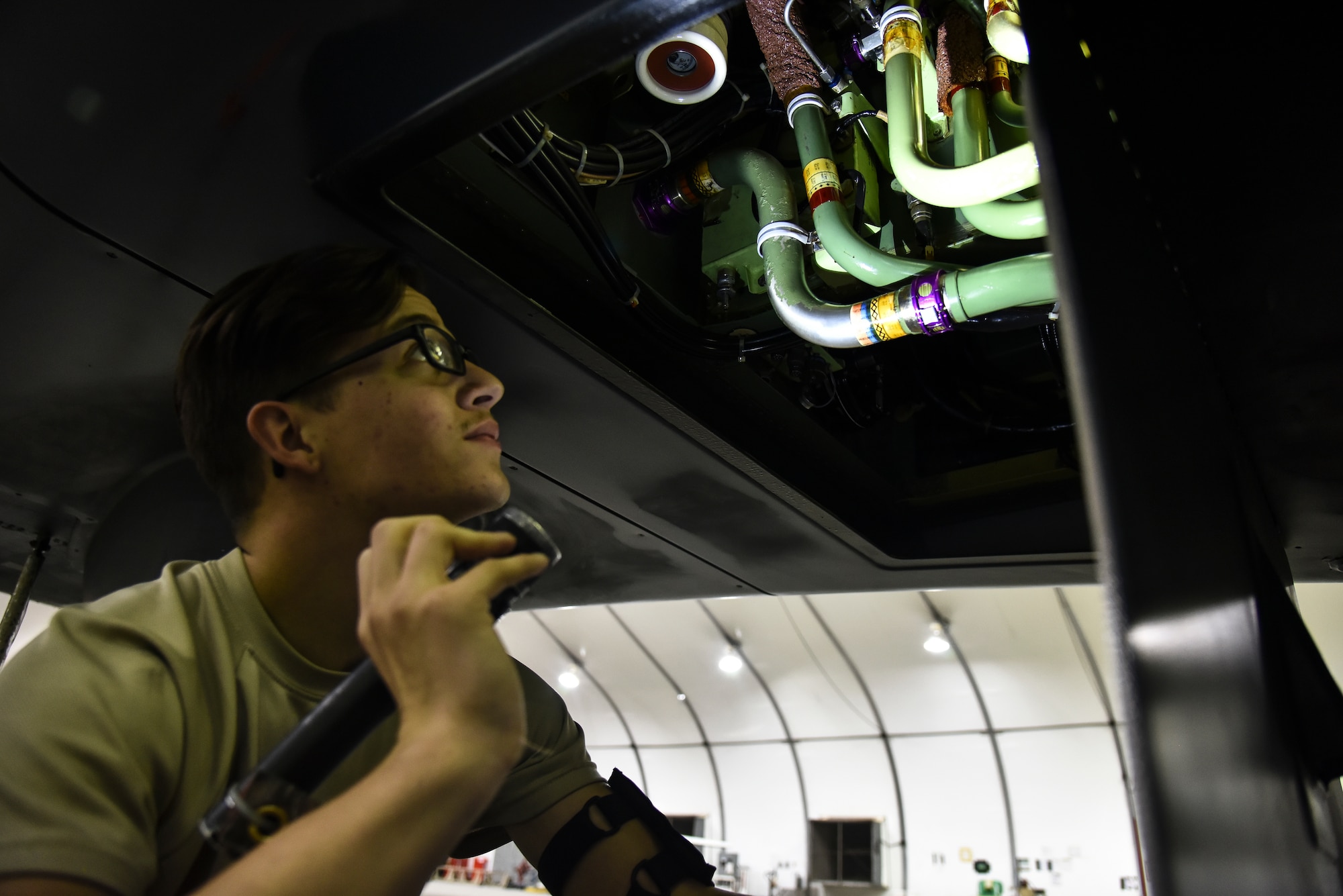 U.S. Air Force Airman 1st Class Nathan Horsley, 380th Expeditionary Aircraft Maintenance Squadron RQ-4 Global Hawk crew chief, conducts a pre-flight inspection on an RQ-4 at Al Dhafra Air Base, United Arab Emirates, Dec. 20, 2018. The crew chief’s extensive list of responsibilities including for pre-, post- and thru-flight checks, and well as various inspections, allows them to fully understand their vital role, making them jacks-of-all-trades when it comes to repairing the aircraft. (U.S. Air Force photo by Senior Airman Mya M. Crosby)