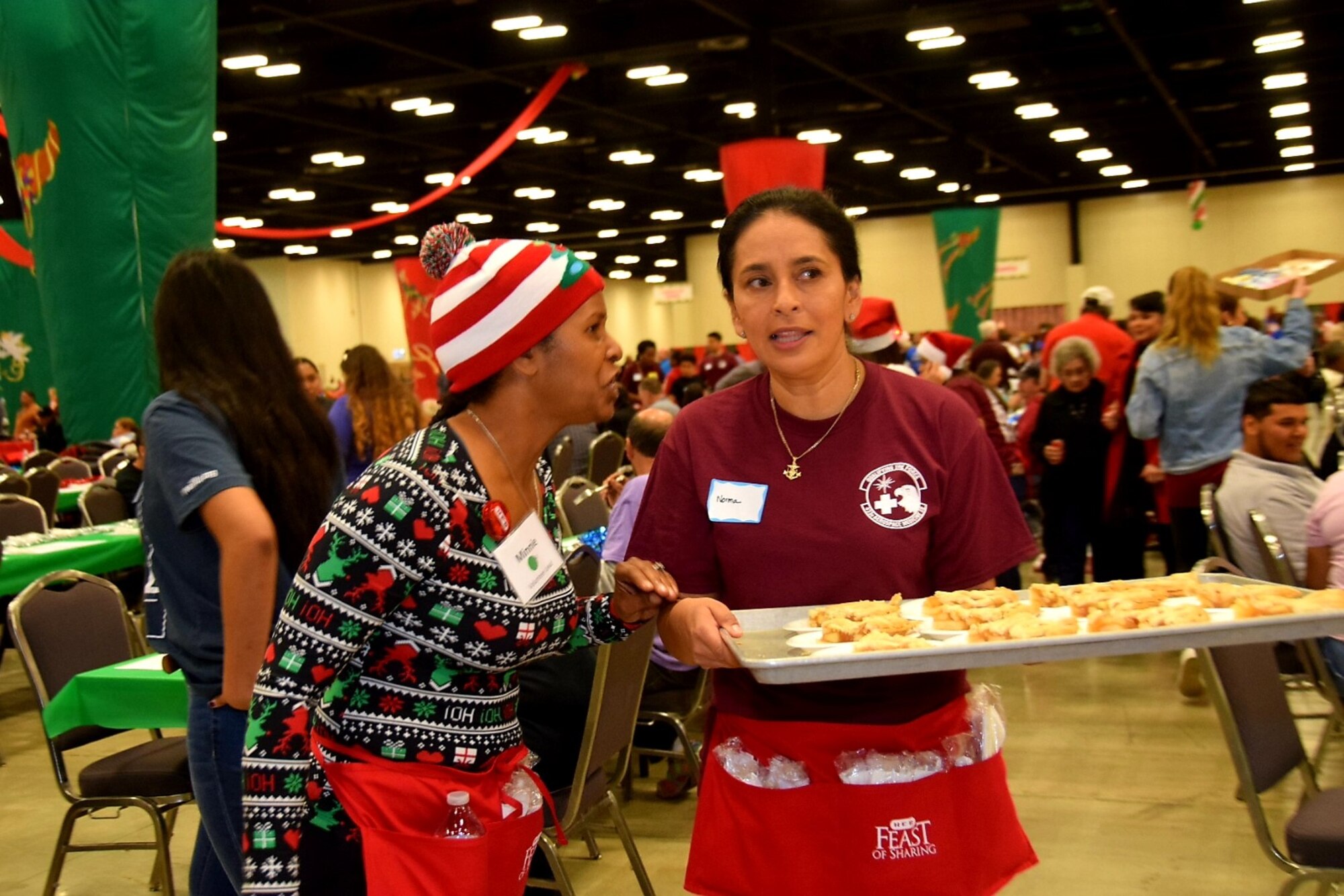 Reserve Citizen Airmen from the 433rd Airlift Wing joined forces with 1,000 other volunteers from the Greater San Antonio Area in serving more than 10,000 meals during the afternoon shift at H-E-B’s 26th Annual Feast of Sharing holiday dinner Dec. 23 at the Henry B. Gonzalez Convention Center in San Antonio, Texas.
