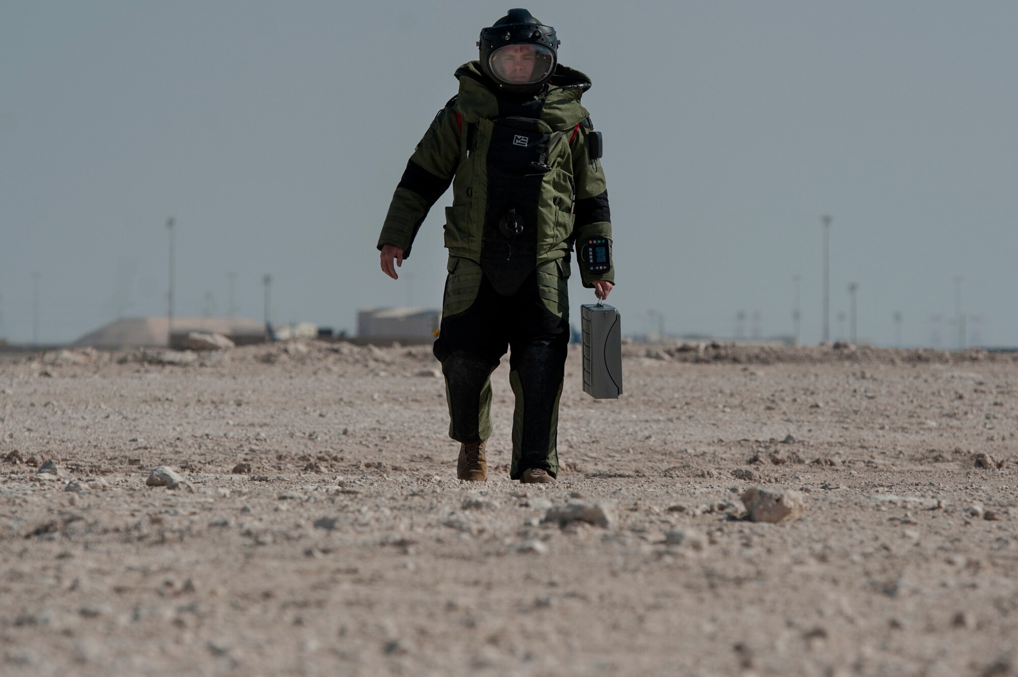 Tech. Sgt. Michael Case, 379th Expeditionary Civil Engineer Squadron explosive, ordnance, and disposal (EOD) team member, approaches a simulated vehicle borne improvised explosive device (VBIED) while wearing an EOD 10 Bomb Suit, during a VBIED response training exercise Dec. 18, 2018, at Al Udeid Air Base, Qatar. Training participants utilized an F6A robotic platform, a bomb suit, and other specific tools to disrupt a VBIED during the exercise. (U.S. Air Force photo by Tech. Sgt. Christopher Hubenthal)