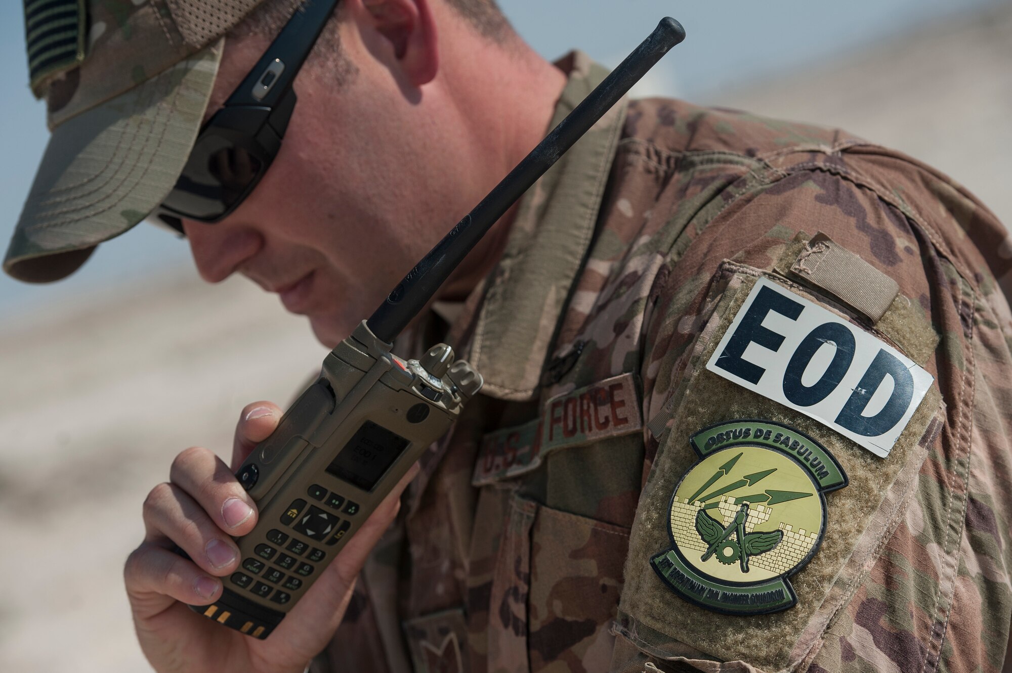 Tech. Sgt. Matthew Workoff, 379th Expeditionary Civil Engineer Squadron explosive, ordnance, and disposal (EOD) team leader, coordinates a scenario for a vehicle borne improvised explosive device (VBIED) response training exercise Dec. 18, 2018, at Al Udeid Air Base, Qatar. Training participants utilized an F6A robotic platform, the bomb suit, and other specific tools to disrupt a VBIED during the exercise. (U.S. Air Force photo by Tech. Sgt. Christopher Hubenthal)