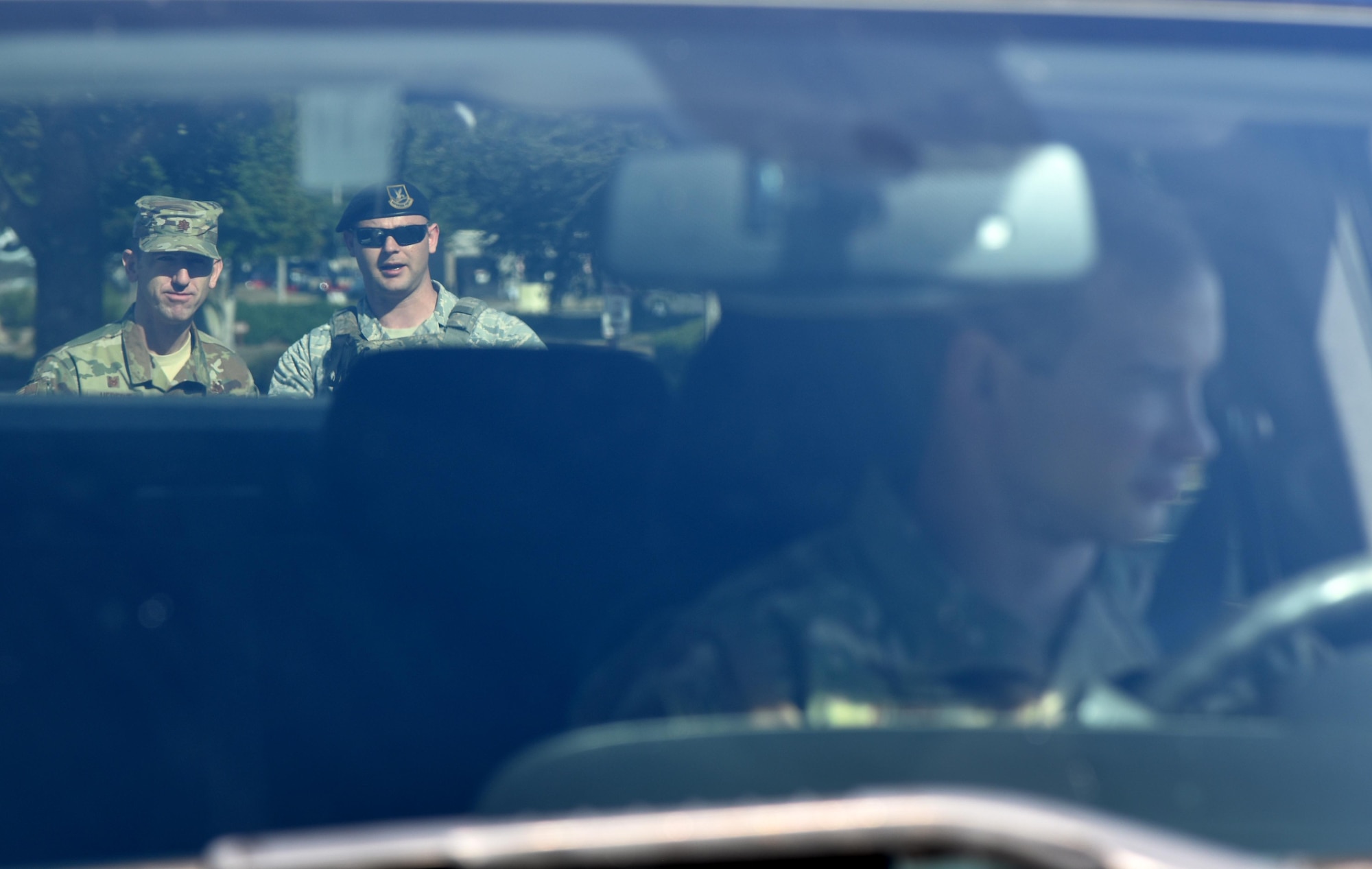 U.S. Air Force Maj. Bruce Hebert, 81st Contracting Squadron commander, and Senior Airman Zachary Vega, 81st Security Forces Squadron unit scheduler, participate in a mock traffic stop during the 81st SFS Day In The Life Of A Defender event at Keesler Air Force Base, Mississippi, Dec. 18, 2018. The event, which was the kick-off for the Year Of The Defender, allowed the 81st SFS to showcase their training and mission capabilities to Keesler leadership. (U.S. Air Force photo by Kemberly Groue)