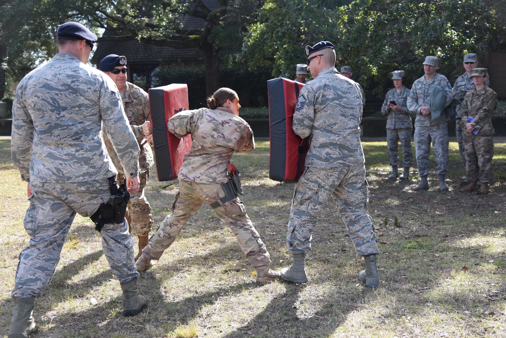 Members of the 81st Security Forces Squadron participate in an oleoresin capiscum spray combat demonstration during the 81st SFS Day In The Life Of A Defender event at Keesler Air Force Base, Mississippi, Dec. 18, 2018. The event, which was the kick-off for the Year Of The Defender, allowed the 81st SFS to showcase their training and mission capabilities to Keesler leadership. (U.S. Air Force photo by Kemberly Groue)