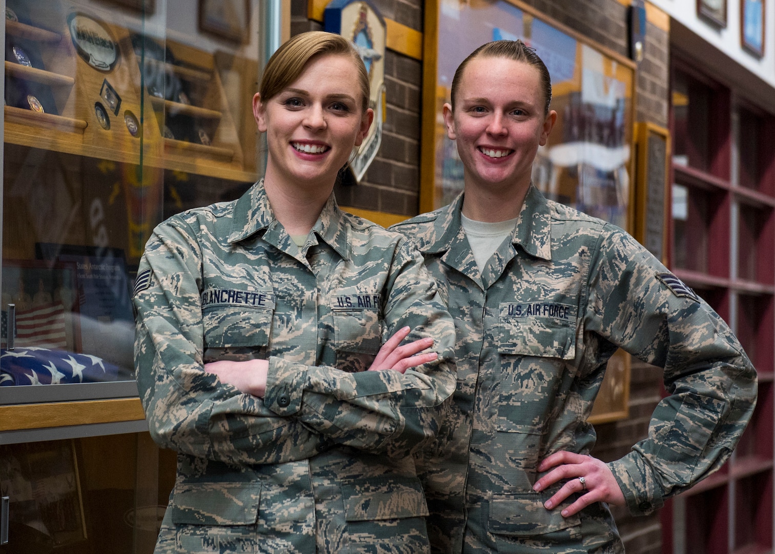 Staff Sgts. Erica Blanchette and Alyssa Nelson pose for a photo Dec. 20, 2018, at Bangor National Guard Base, Maine. The sisters, who are also identical twins, swore in eight months apart.