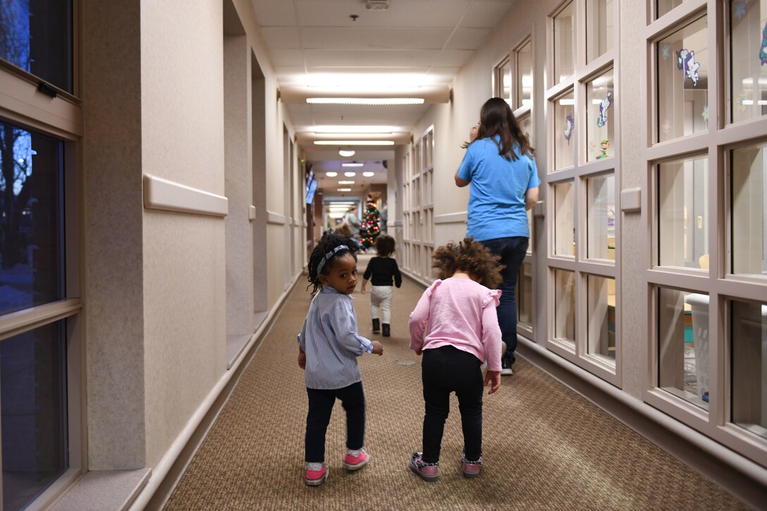 After a long day of playing and learning, the toddlers make their way to another room to be picked up by their parents at the McRaven Child Development Center on Ellsworth Air Force Base, S.D., Dec. 6, 2018. The CDC provides military parents with a clean, safe and loving place to bring their children while they work to accomplish the mission. (U.S. Air Force photo by Airman 1st Class Christina Bennett)