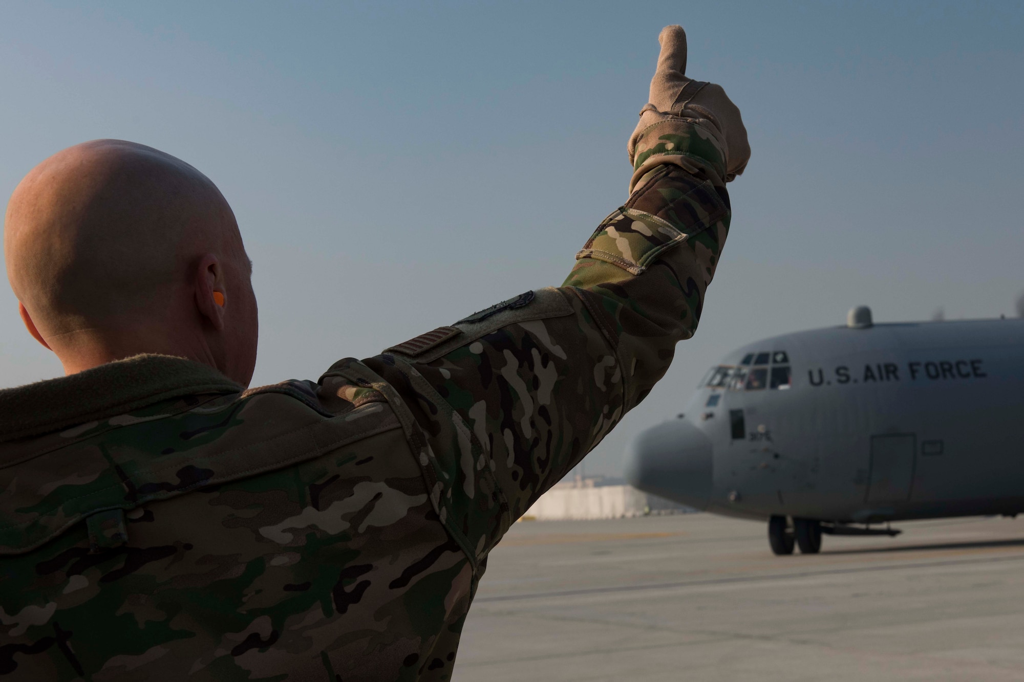 Air Force Col. Joseph Miller, 455th Air Expeditionary Wing vice commander, greets an aircraft carrying Air Force Chief of Staff David L. Goldfein and the Chief Master Sgt. of the Air Force Kaleth O. Wright during a recent visit to Bagram Airfield, Afghanistan, Dec. 25, 2018. Airmen were given the opportunity to discuss changes occurring in the Air Force with leadership during the visit. (U.S. Air Force photo by Senior Airman Kaylee Dubois)