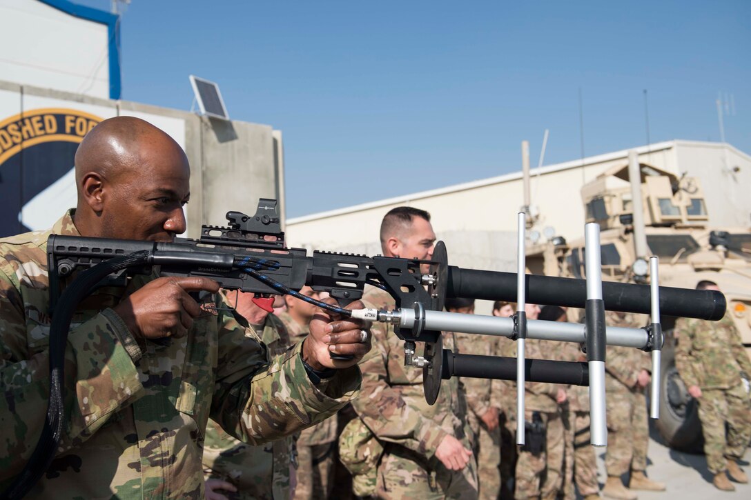 Chief Master Sgt. of the Air Force Kaleth O. Wright gets a hands-on demonstration of a counter-unmanned aircraft system known as a 'Drone Defender' during a visit with the 455th Expeditionary Security Forces Squadron at Bagram Airfield, Afghanistan, Dec. 25, 2018. Wright and Air Force Chief of Staff Gen. David L. Goldfein spoke about the “Year of the Defender” and some changes security forces Airmen will see during training exercises. (U.S. Air Force photo by Senior Airman Kaylee Dubois)