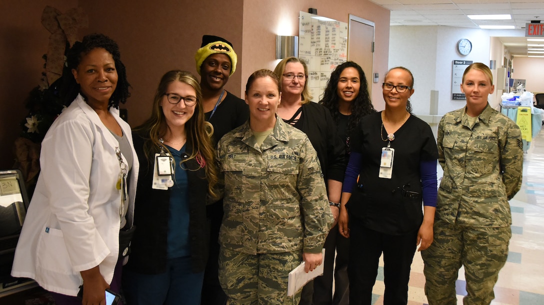 Members of the 118th Wing, Tennessee Air National Guard pose with employees from the Nashville Veteran Affairs Medical Center on Dec. 13, 2018 at the Nashville VA Medical Center, Nashville, Tennessee.