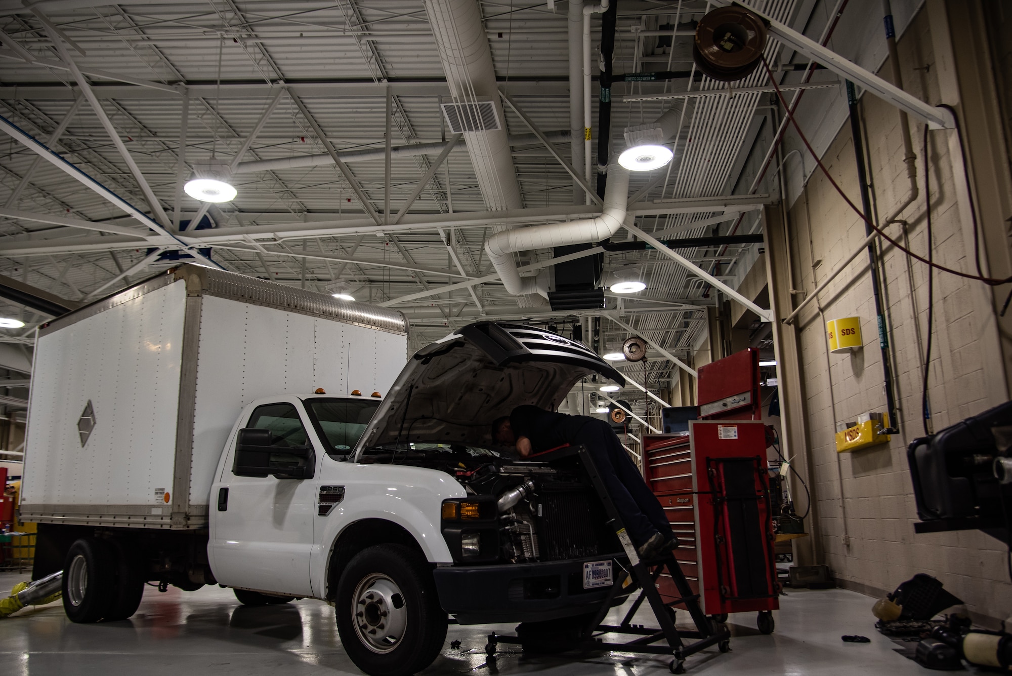 U.S. Air Force Staff Sgt. Joseph Beasley, 20th Logistics Readiness Squadron vehicle maintenance craftsman, removes a valve cover off the engine of a vehicle at Shaw Air Force Base, S.C., Dec. 20, 2018.