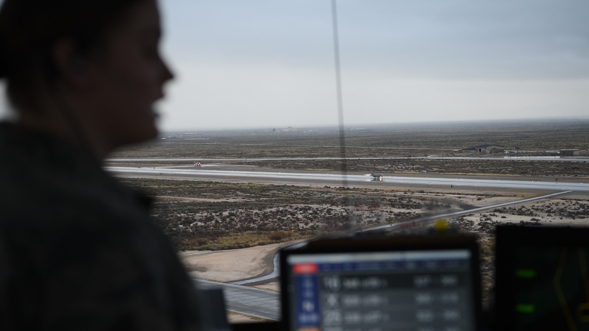 Senior Airman Kaitlyn Hopp, 54th Operations Support Squadron air traffic controller, gives a traffic call as an F-16 Fighting Falcon takes off, Dec. 18, 2018, on Holloman Air Force Base, N.M. Before an F-16 can take off or land they must be in contact with the air traffic control tower to ensure the runway is clear. (U.S. Air Force photo by Staff Sgt. BreeAnn Sachs)