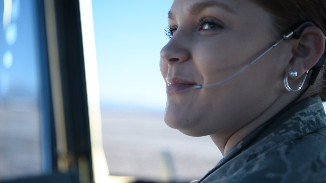 Airman 1st Class Alyssa Rogers, 54th Operations Support Squadron air traffic control trainee, observes the airfield after giving a traffic call, Dec. 18, on Holloman Air Force Base, N.M. Controllers are not authorized to give traffic calls without at least a 5-level air traffic controller observing them (U.S. Air Force photo by Staff Sgt. BreeAnn Sachs)