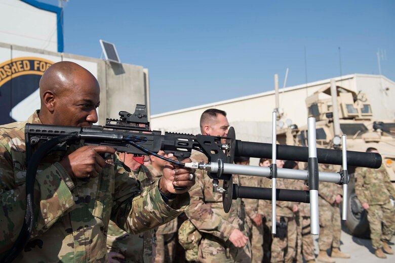 Chief Master Sgt. of the Air Force Kaleth O. Wright gets a hands-on demonstration of a counter-unmanned aircraft system known as a 'Drone Defender' during a visit with the 455th Expeditionary Security Forces Squadron at Bagram Airfield, Afghanistan, Dec. 25, 2018. Wright and Air Force Chief of Staff Gen. David L. Goldfein spoke about the “Year of the Defender” and some changes security forces Airmen will see during training exercises. (U.S. Air Force photo by Senior Airman Kaylee Dubois)